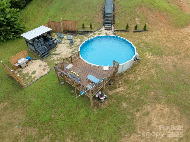 an aerial view of a house with a swimming pool