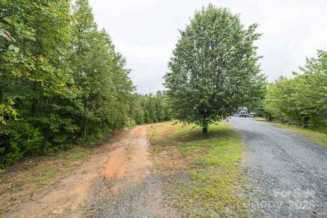 a view of balcony with wooden floor and fence