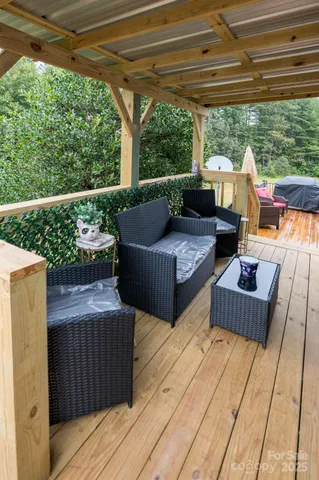 a roof deck with a table and chairs