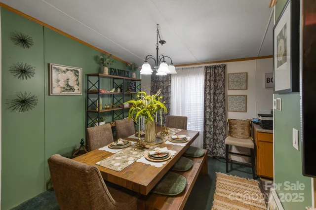 a bedroom with furniture and a large window