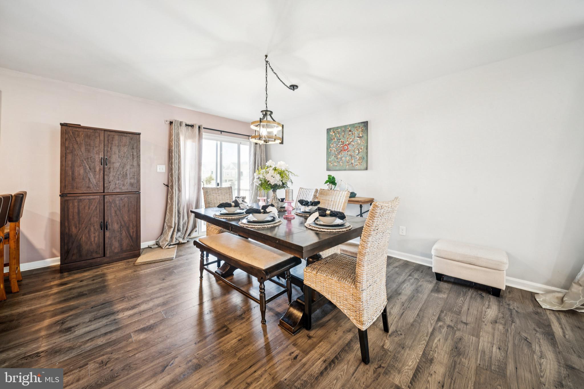 17912 Meriwether Lewis Street Ruther Glen, VA 22546 - Photo 11 of 44 a view of a dining room with furniture and wooden floor