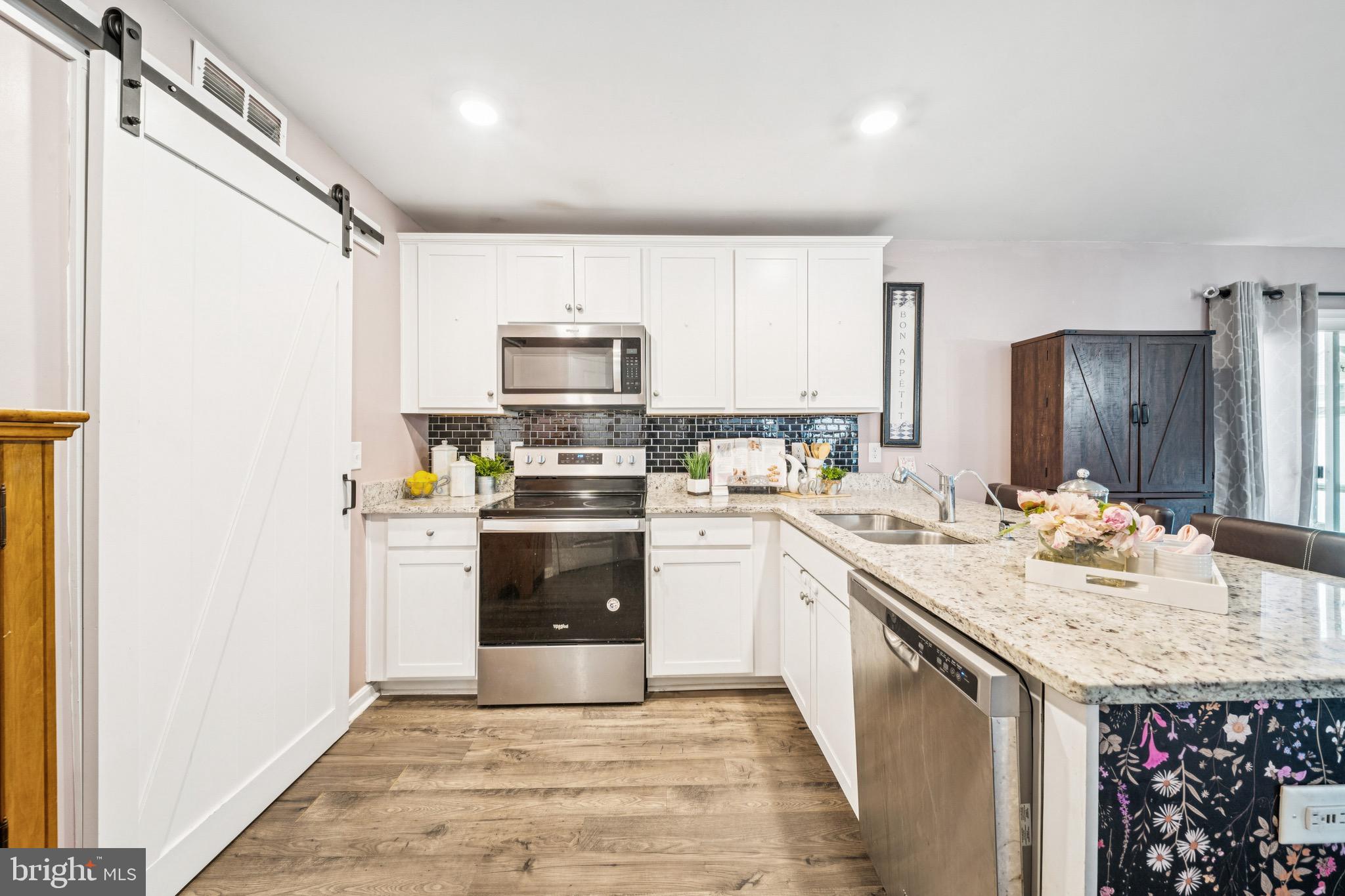 17912 Meriwether Lewis Street Ruther Glen, VA 22546 - Photo 16 of 44 a kitchen with a sink appliances and cabinets