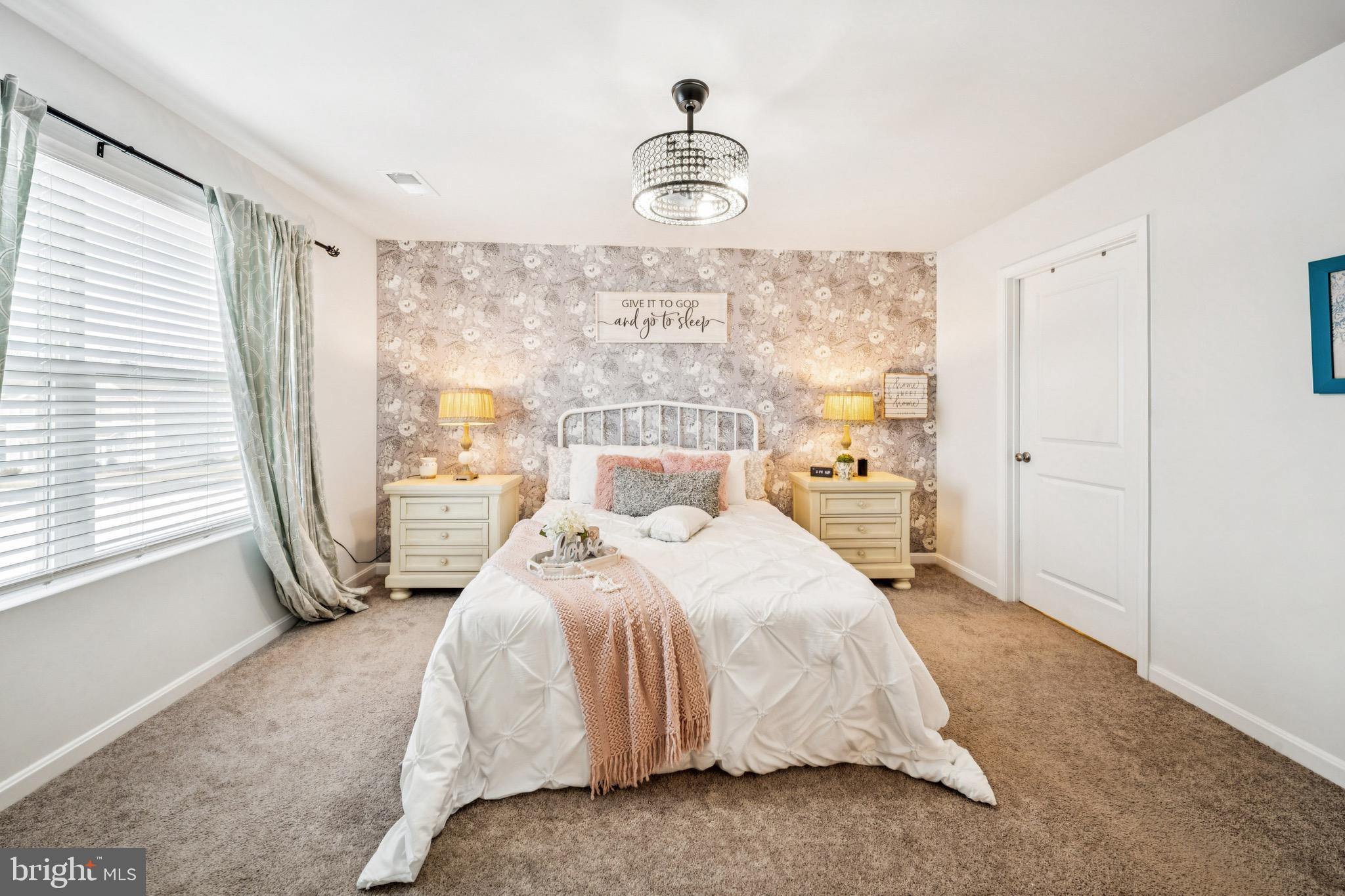 17912 Meriwether Lewis Street Ruther Glen, VA 22546 - Photo 22 of 44 a bed sitting in a spacious bedroom next to a window
