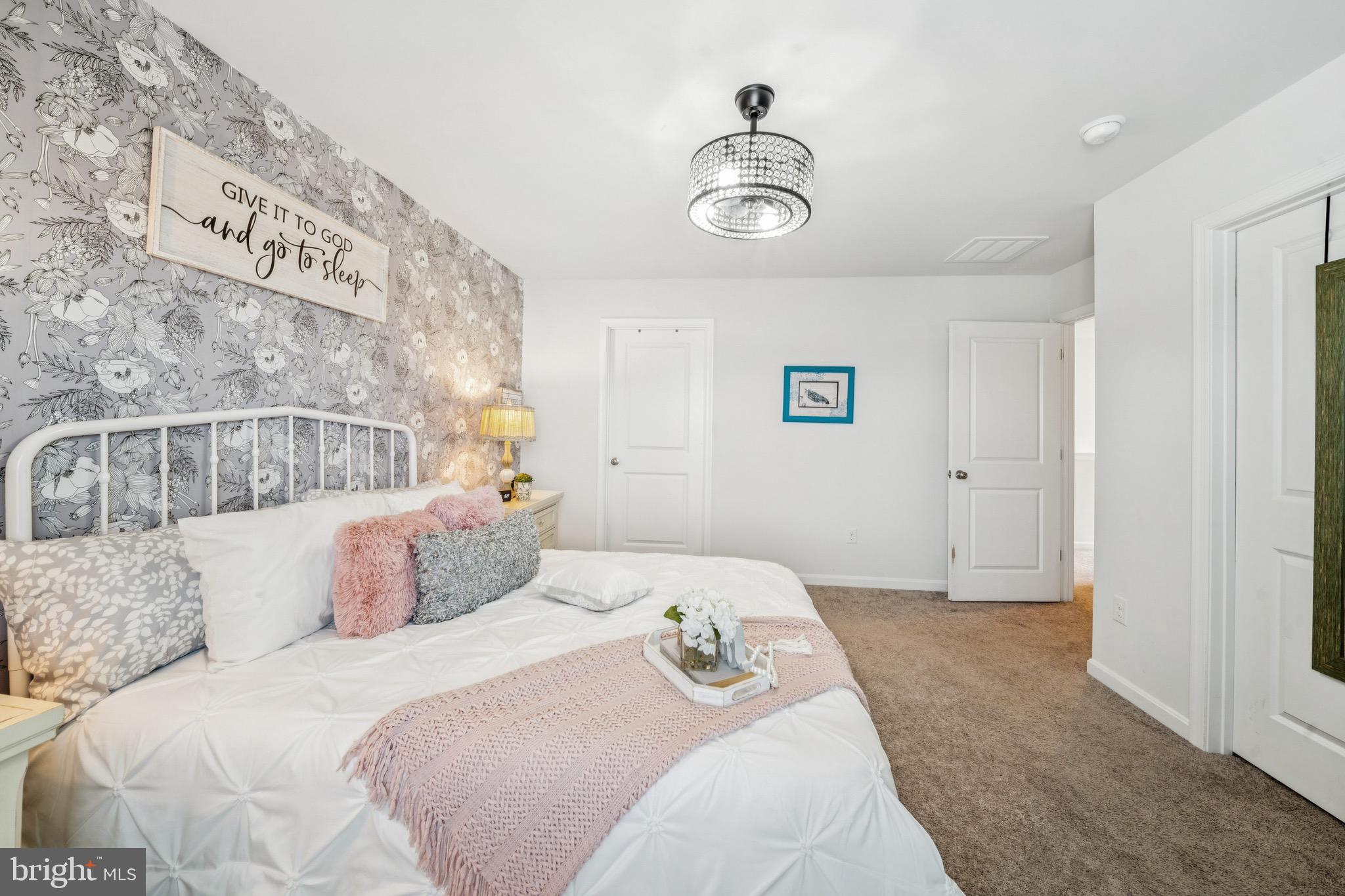 17912 Meriwether Lewis Street Ruther Glen, VA 22546 - Photo 23 of 44 a bedroom with a bed and a window