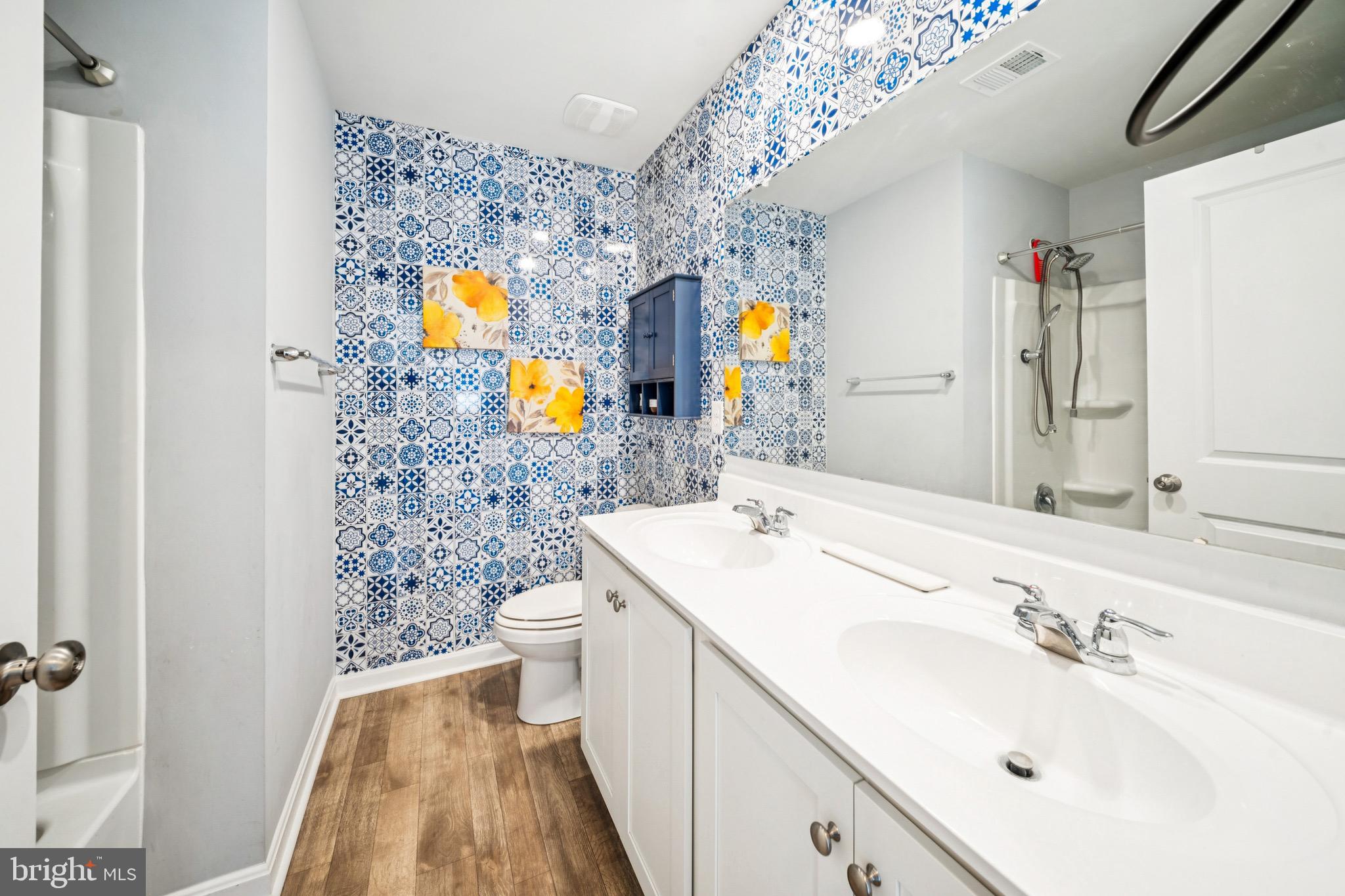 17912 Meriwether Lewis Street Ruther Glen, VA 22546 - Photo 25 of 44 a bathroom with a sink mirror vanity and toilet