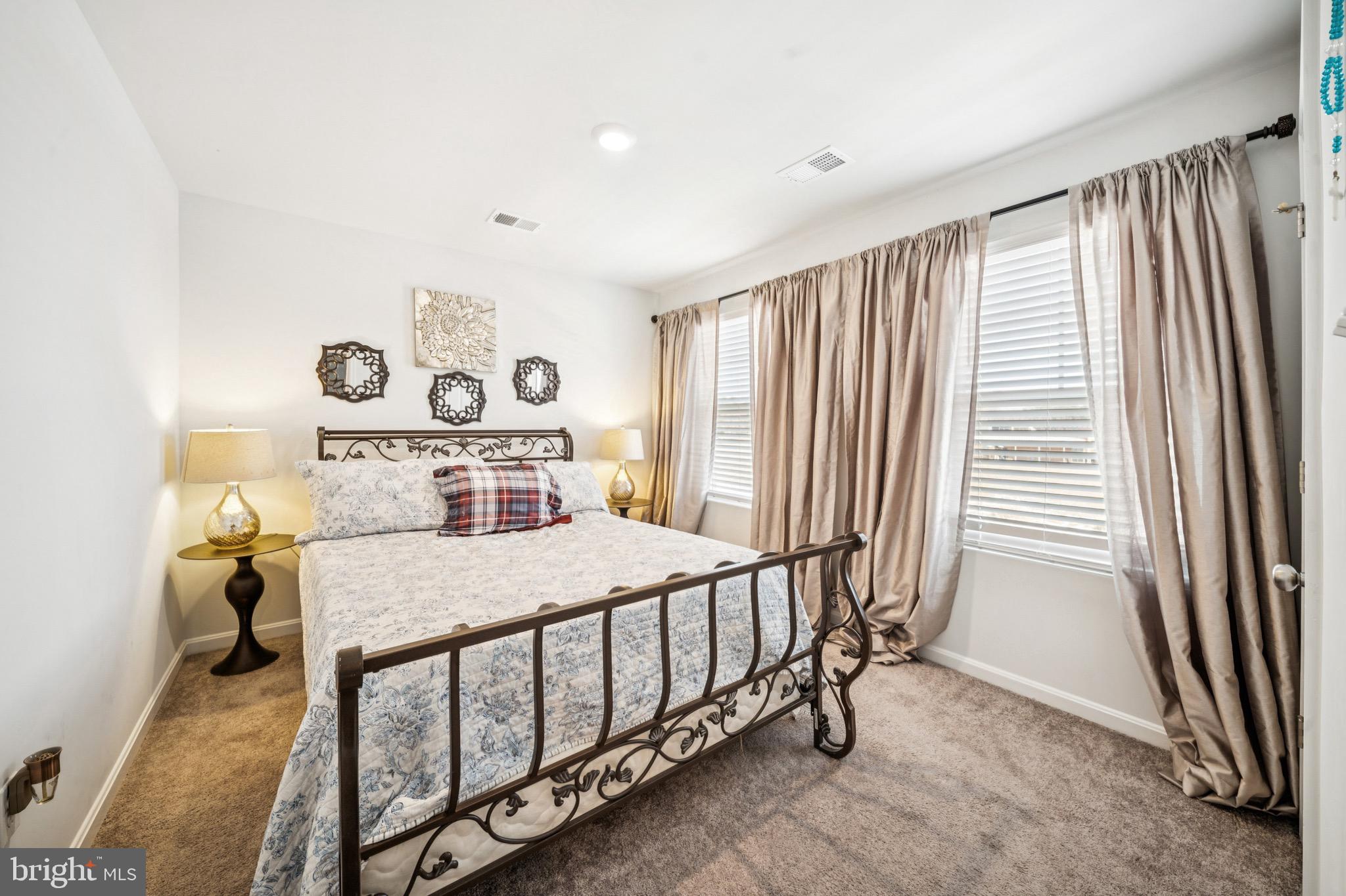 17912 Meriwether Lewis Street Ruther Glen, VA 22546 - Photo 26 of 44 a bedroom with a bed and a window