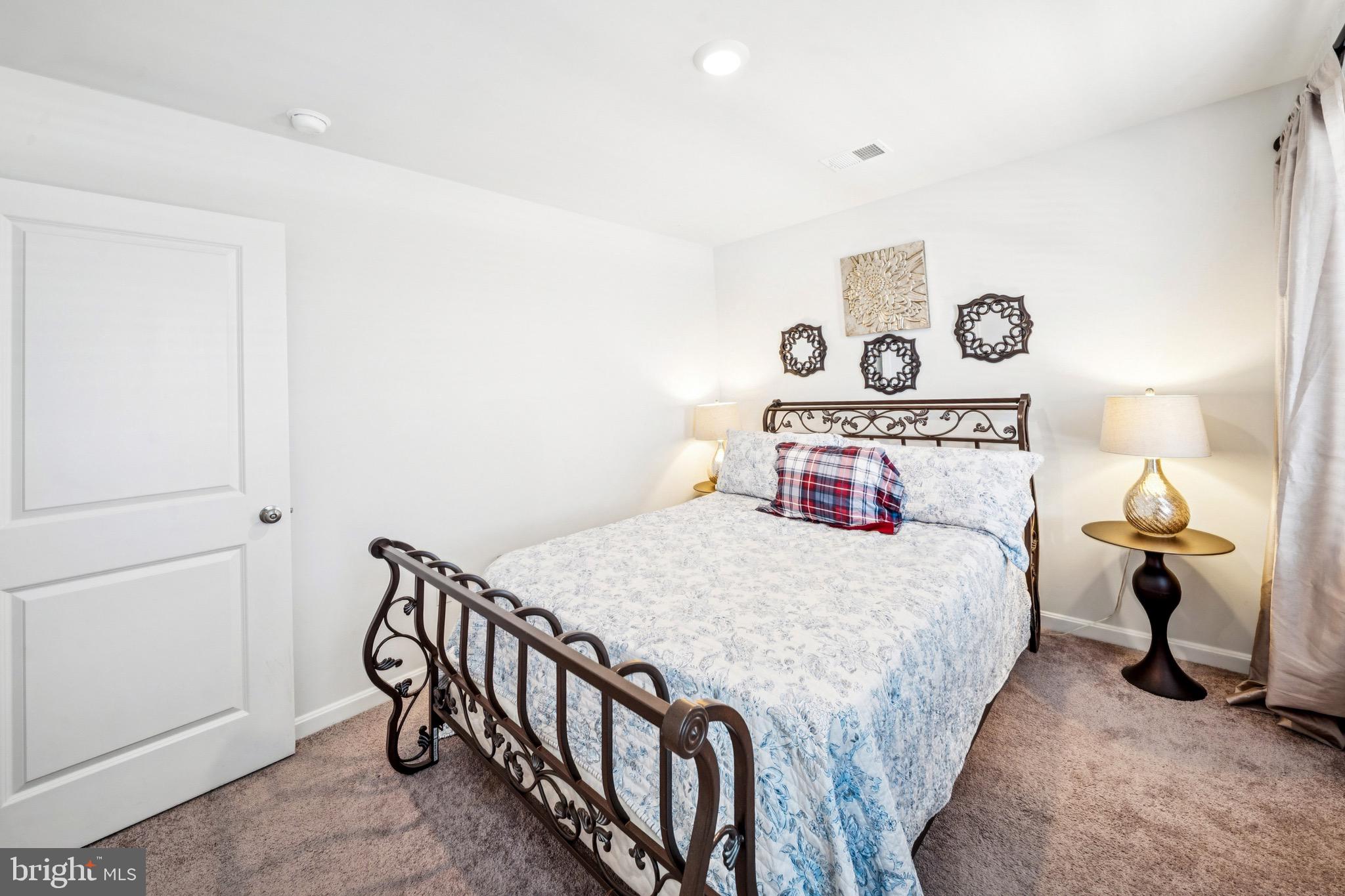 17912 Meriwether Lewis Street Ruther Glen, VA 22546 - Photo 28 of 44 a bedroom with a bed and a window