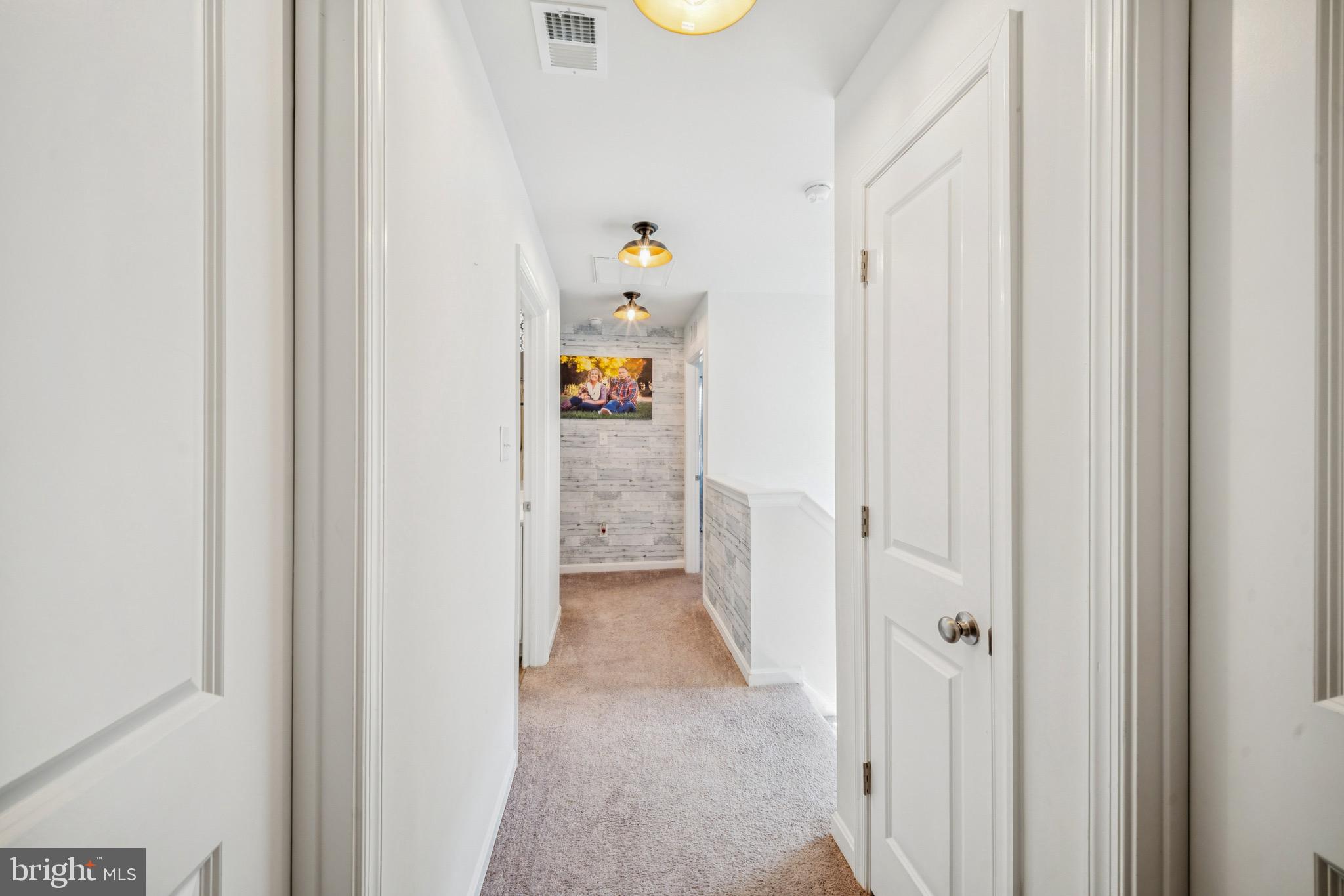 17912 Meriwether Lewis Street Ruther Glen, VA 22546 - Photo 32 of 44 a view of hallway with dining area