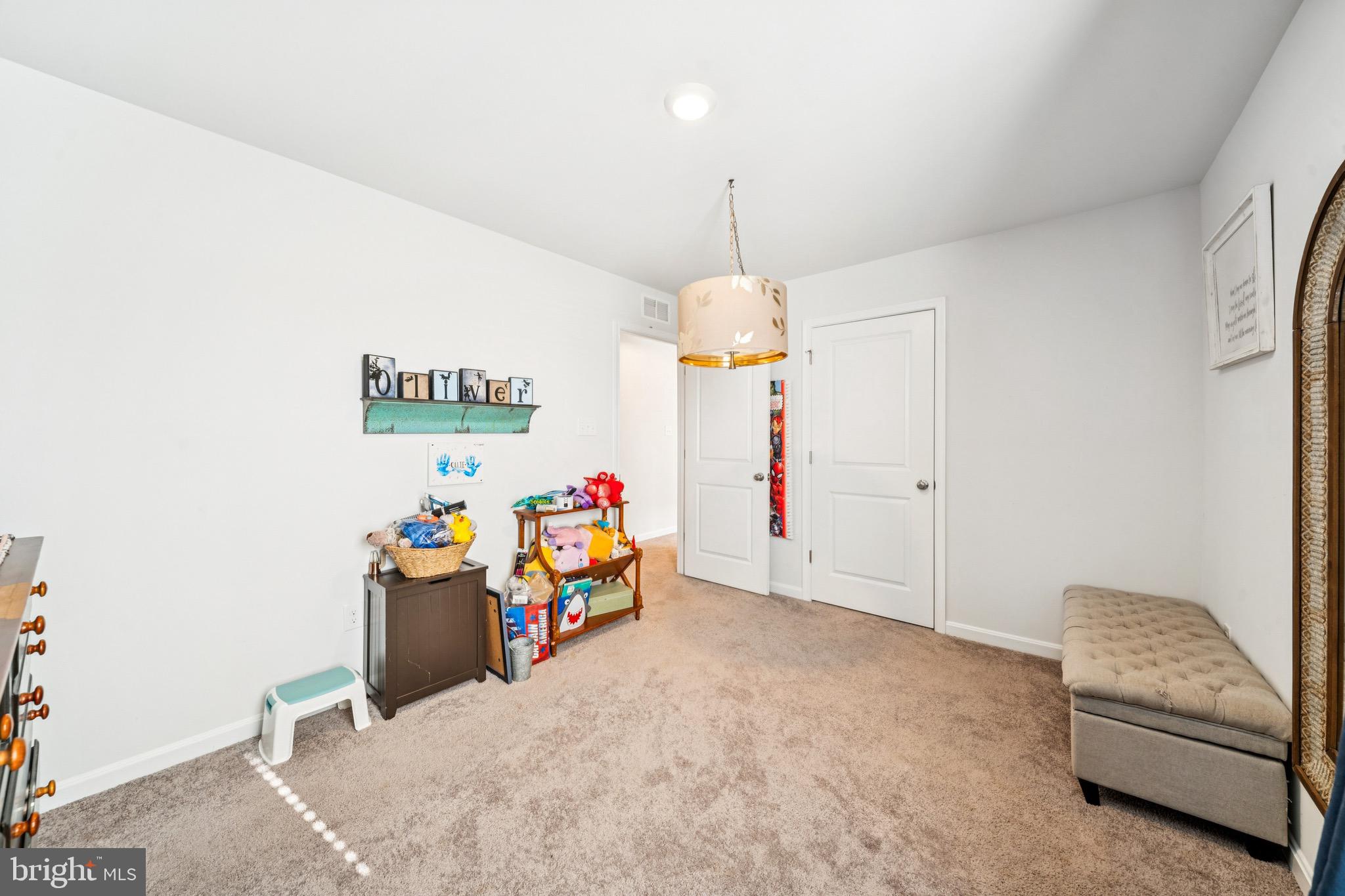 17912 Meriwether Lewis Street Ruther Glen, VA 22546 - Photo 34 of 44 a view of a room with furniture and a chandelier