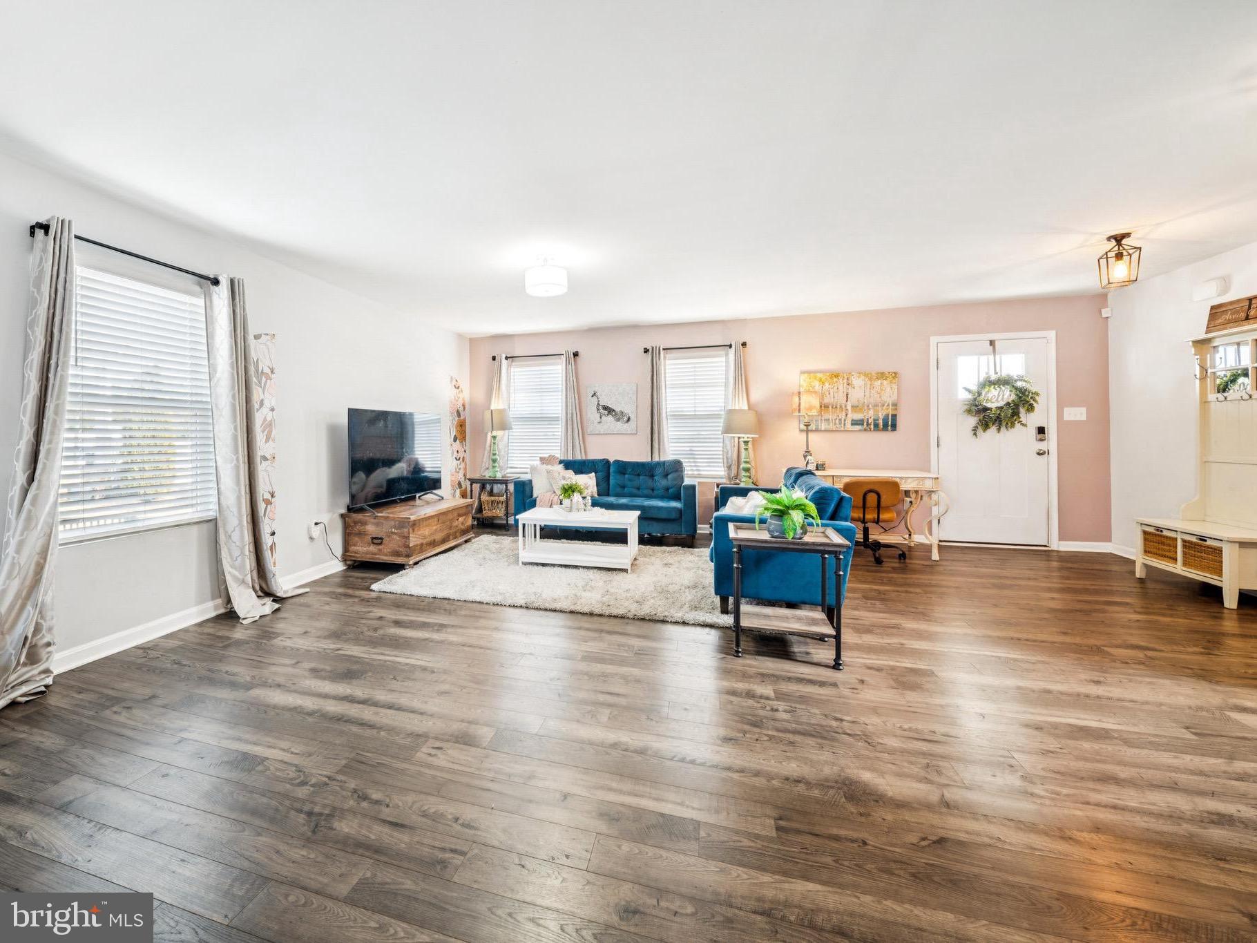 17912 Meriwether Lewis Street Ruther Glen, VA 22546 - Photo 6 of 44 a living room with furniture and a wooden floor
