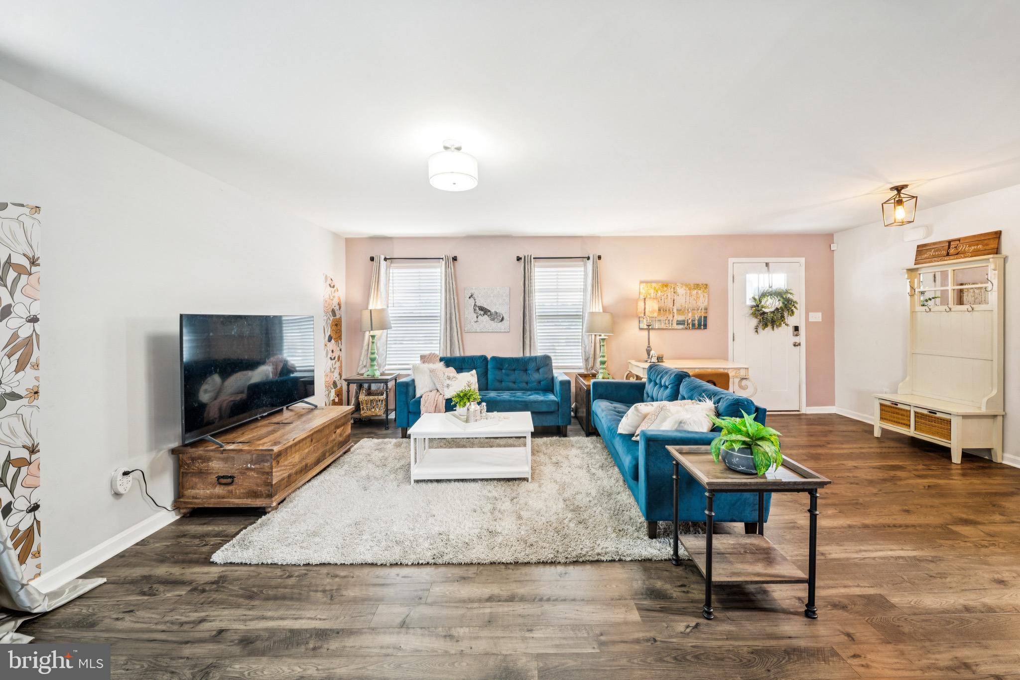 17912 Meriwether Lewis Street Ruther Glen, VA 22546 - Photo 7 of 44 a living room with furniture and a flat screen tv