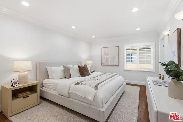 a bed room with a bed and a lamp