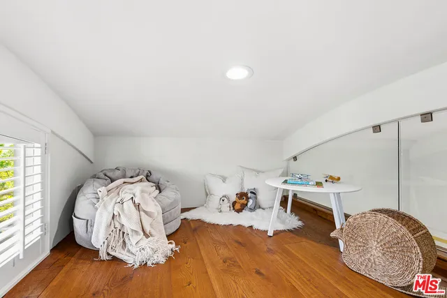 a bed room with a bed and a window