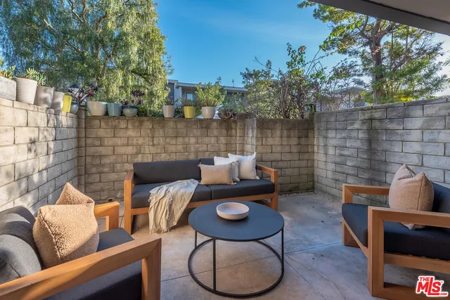 a backyard of a house with seating space