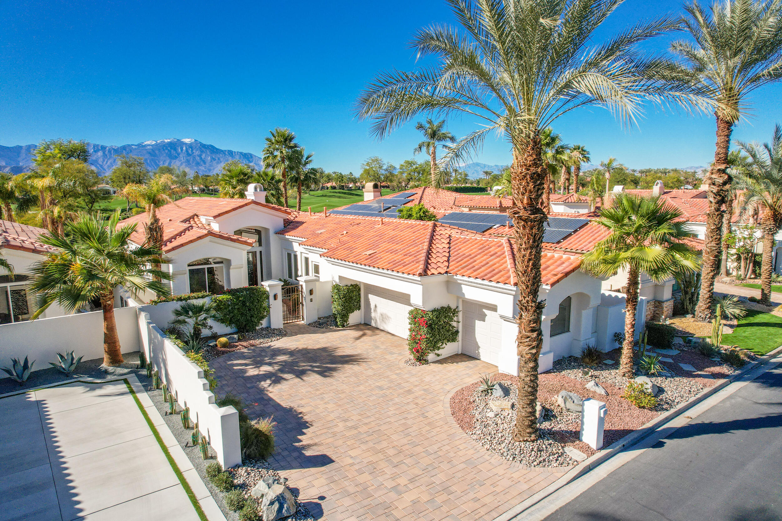 701 Indian Ridge Drive Palm Desert, CA 92211 - Photo 1 of 40 a view of a house with backyard and sitting area