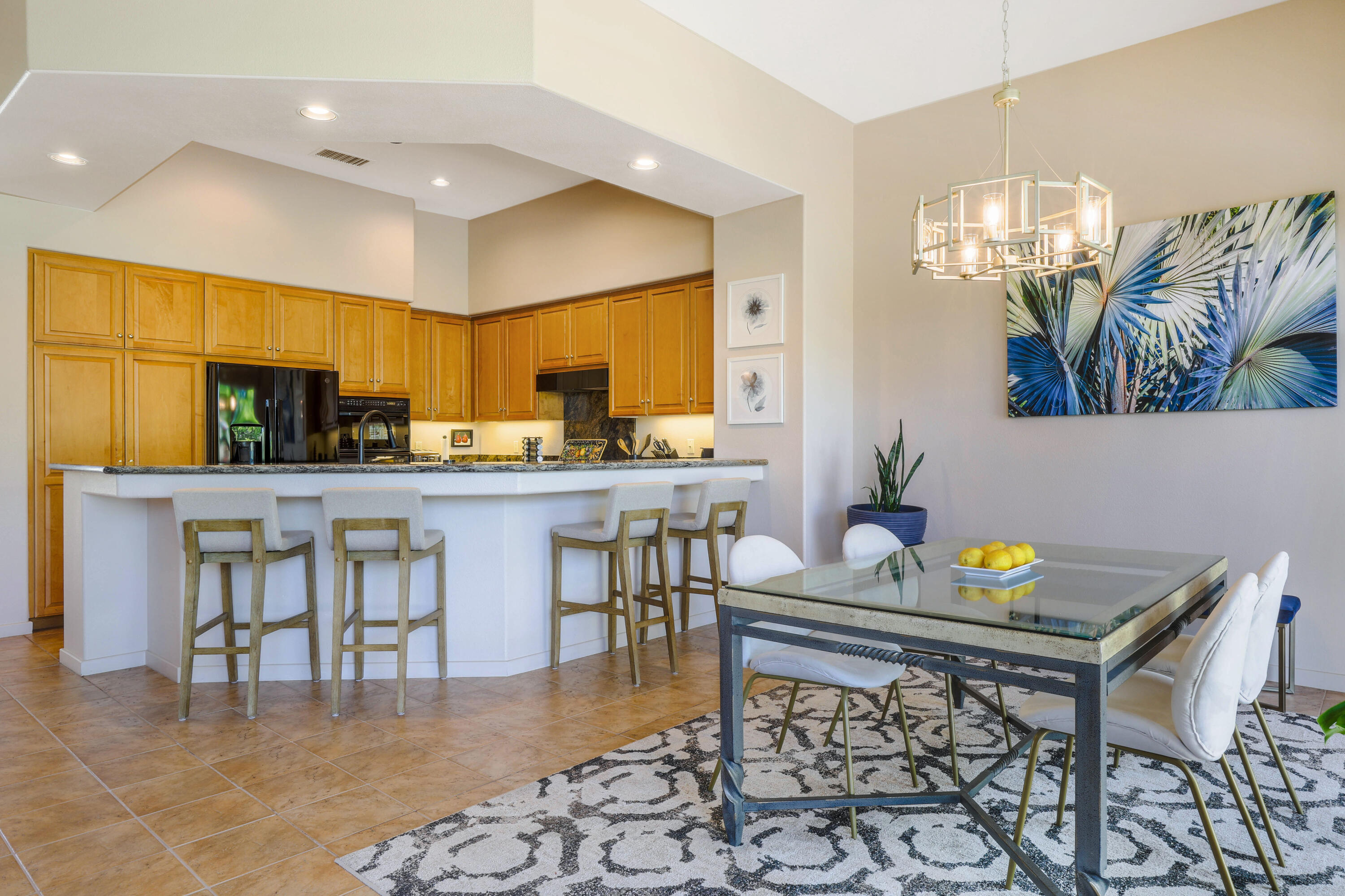 701 Indian Ridge Drive Palm Desert, CA 92211 - Photo 15 of 40 a kitchen with a table and chairs in it