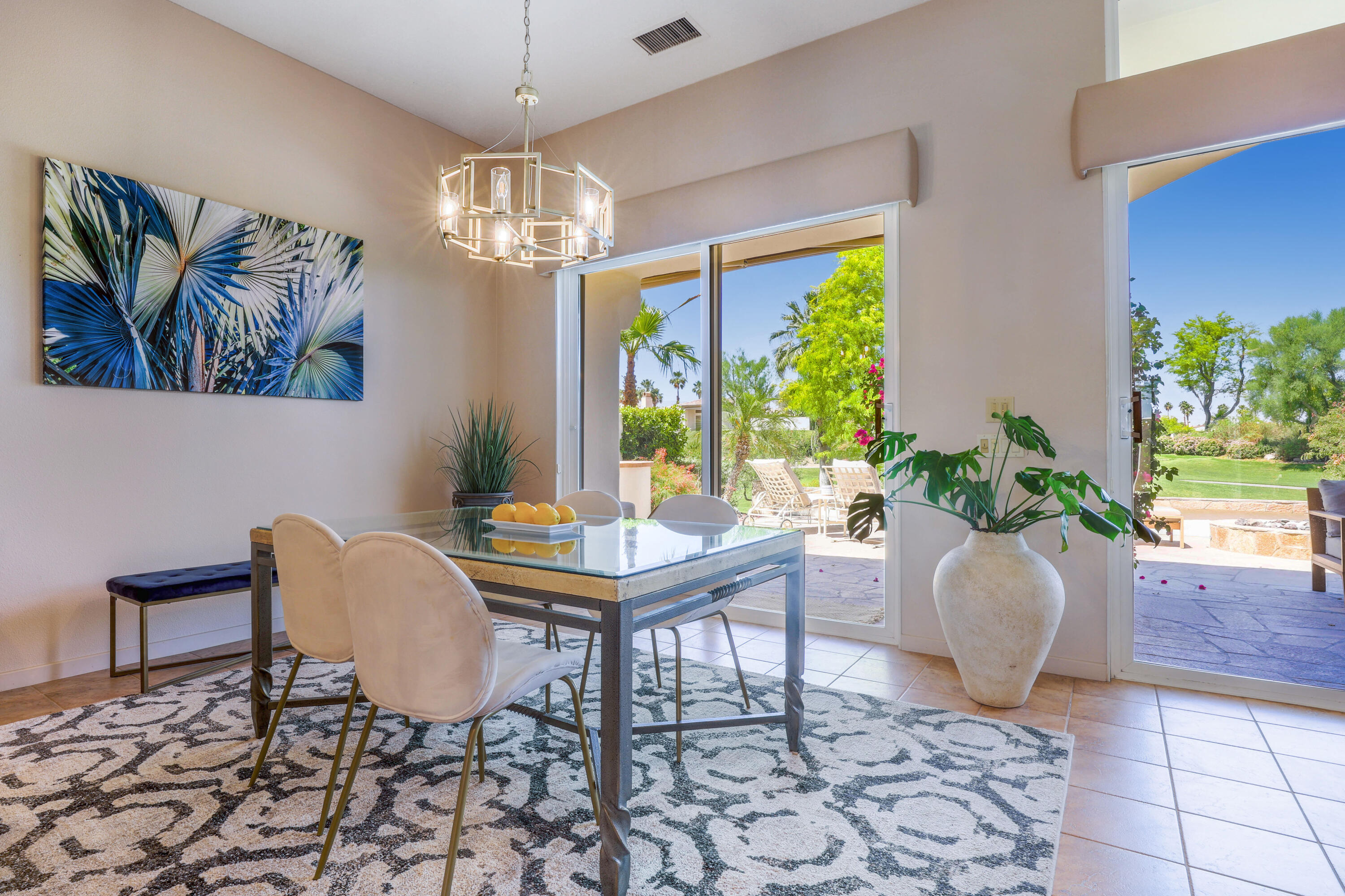 701 Indian Ridge Drive Palm Desert, CA 92211 - Photo 16 of 40 a view of a dining room with furniture window and outside view