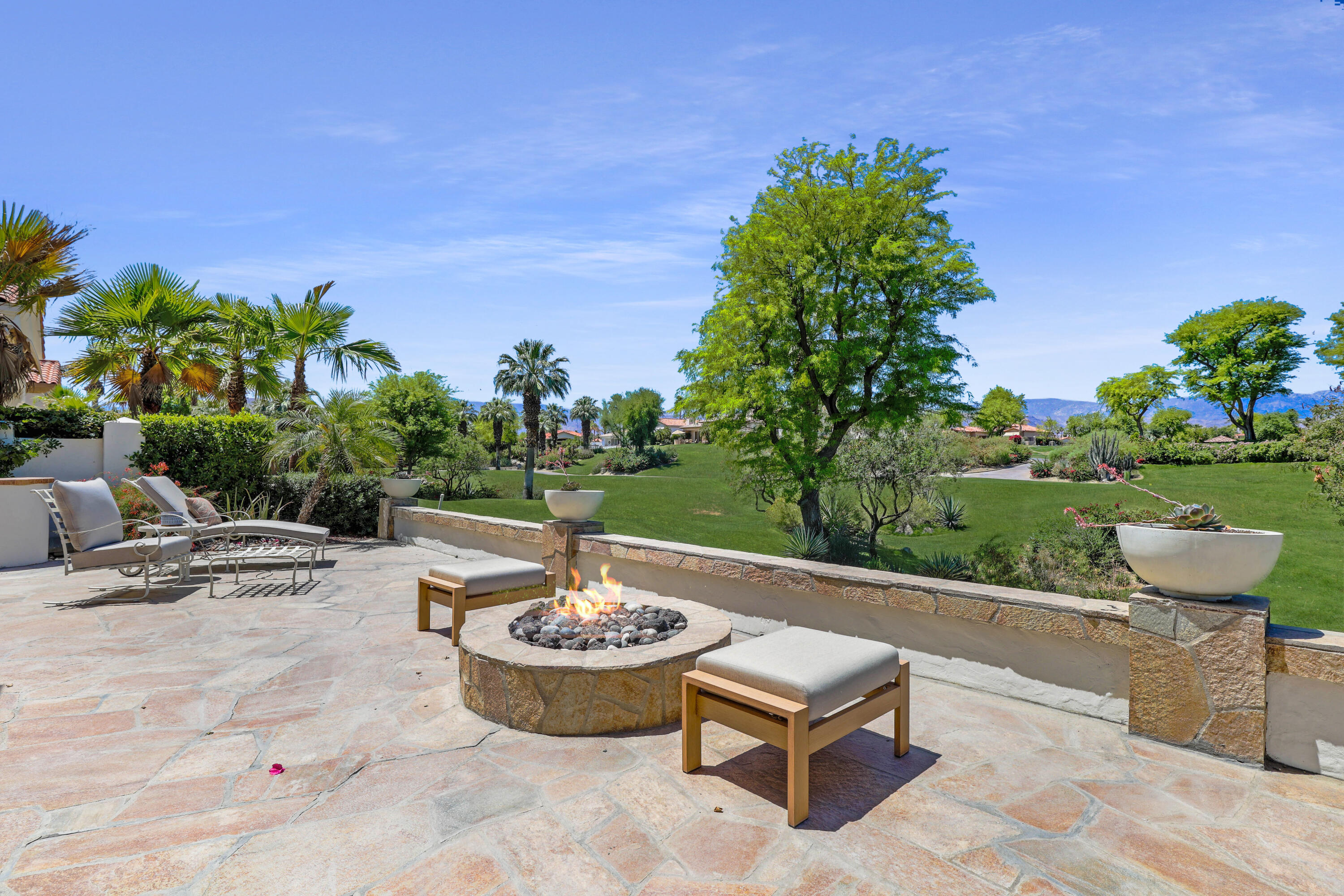 701 Indian Ridge Drive Palm Desert, CA 92211 - Photo 2 of 40 a view of a backyard with sitting area