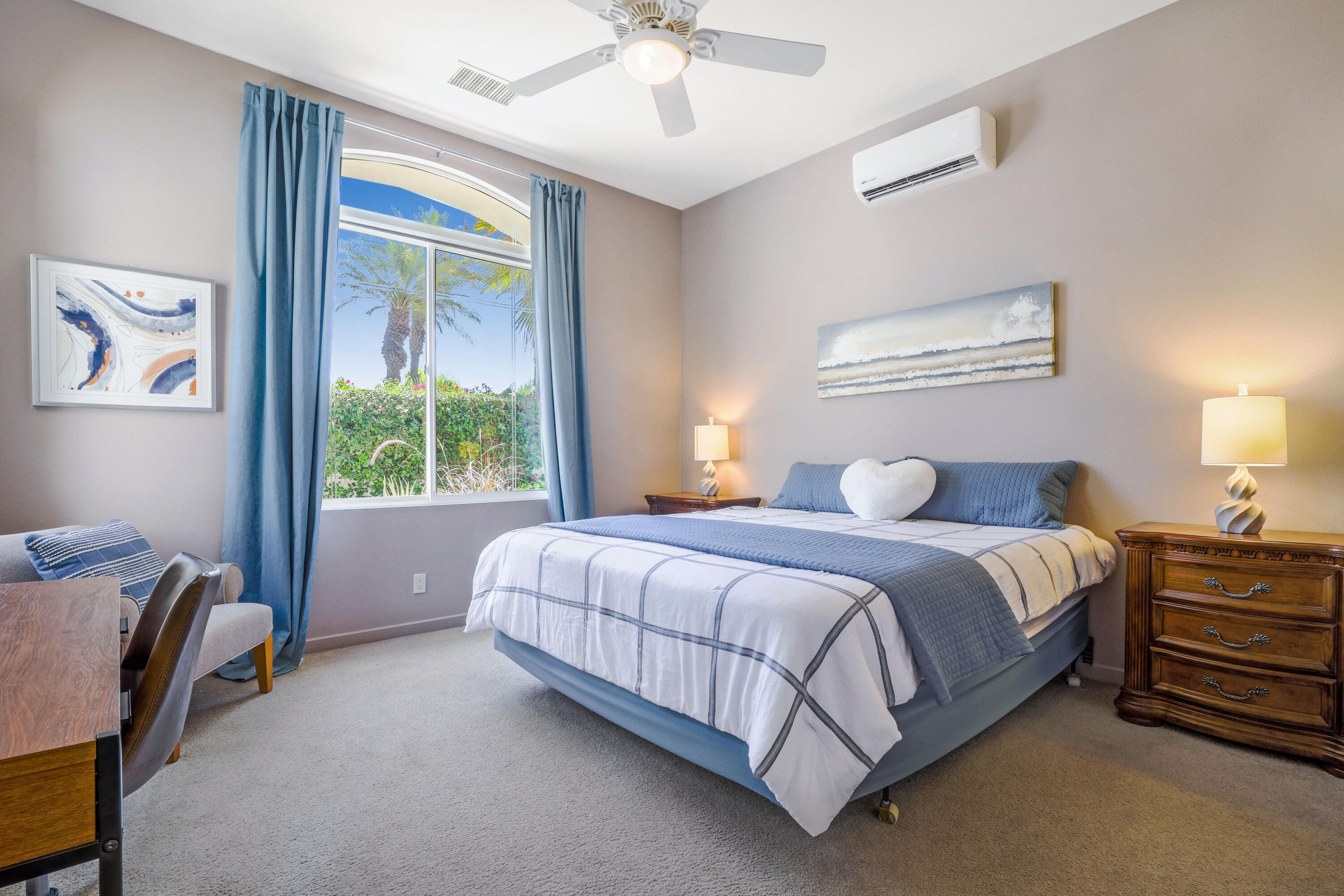 701 Indian Ridge Drive Palm Desert, CA 92211 - Photo 25 of 40 a bed room with a bed and a chandelier