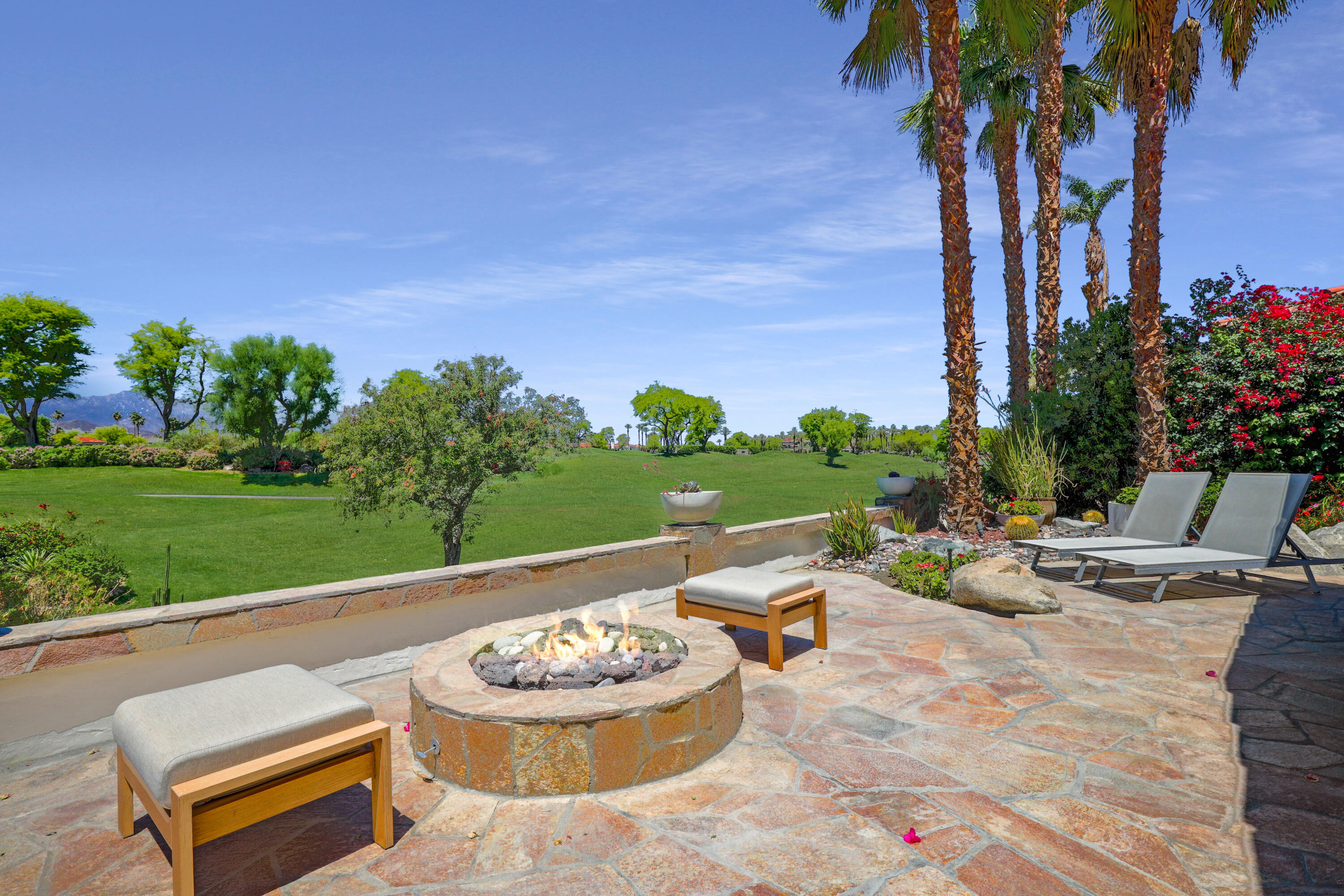 701 Indian Ridge Drive Palm Desert, CA 92211 - Photo 36 of 40 a view of a backyard with plants and outdoor seating