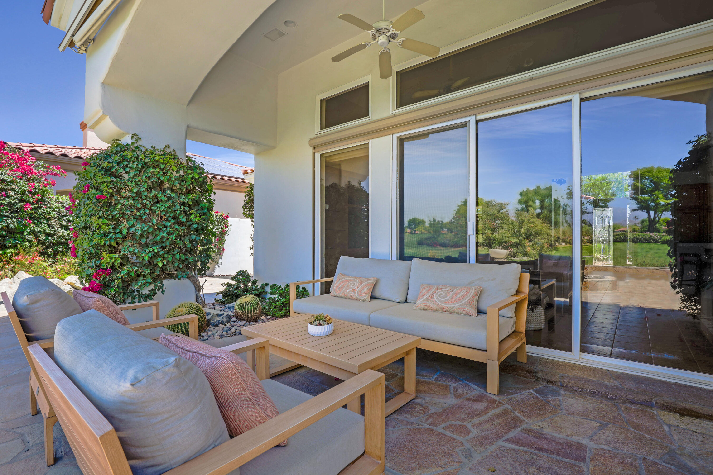 701 Indian Ridge Drive Palm Desert, CA 92211 - Photo 38 of 40 a outdoor living space with furniture and garden view