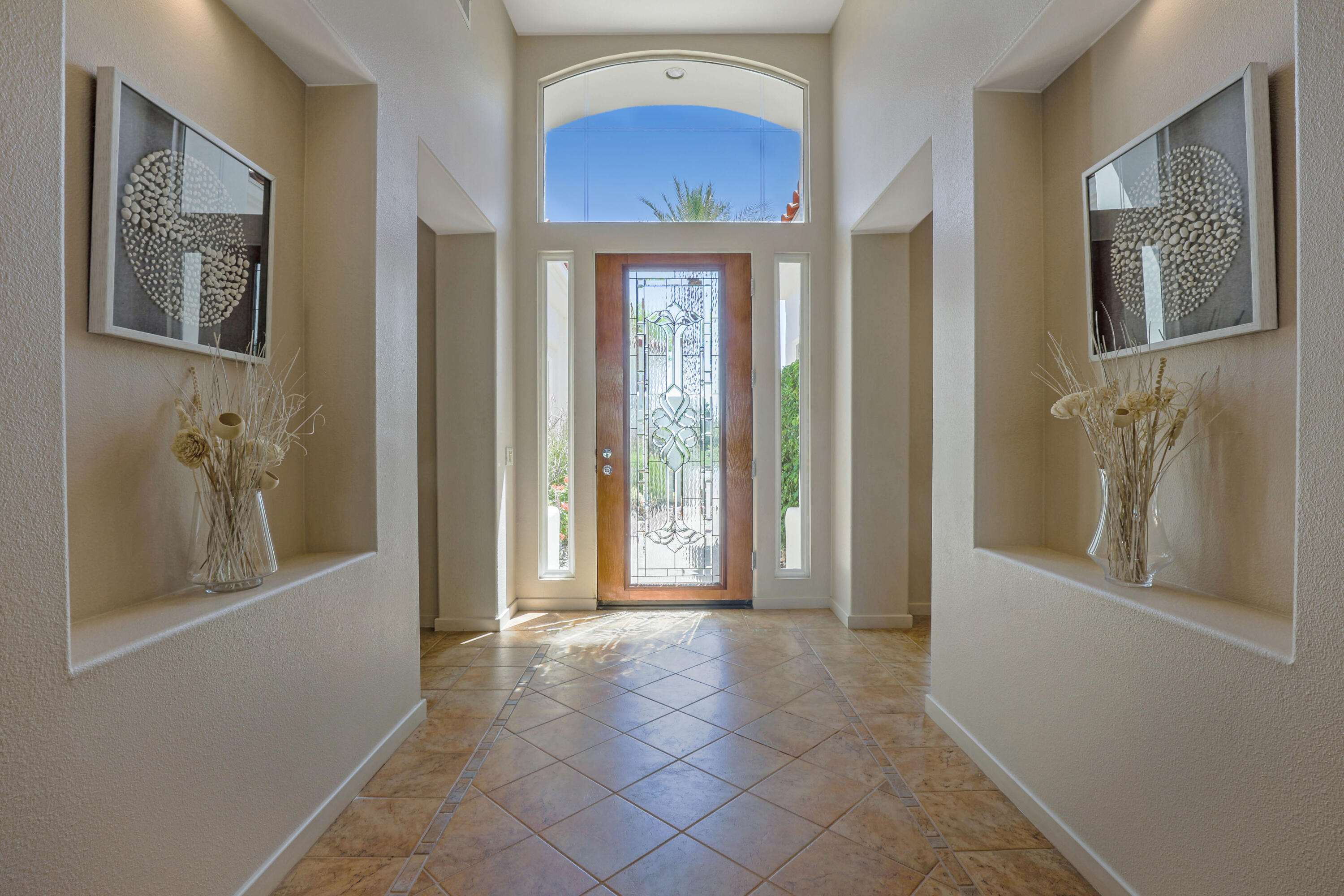 701 Indian Ridge Drive Palm Desert, CA 92211 - Photo 8 of 40 a view of a hallway with windows and entryway