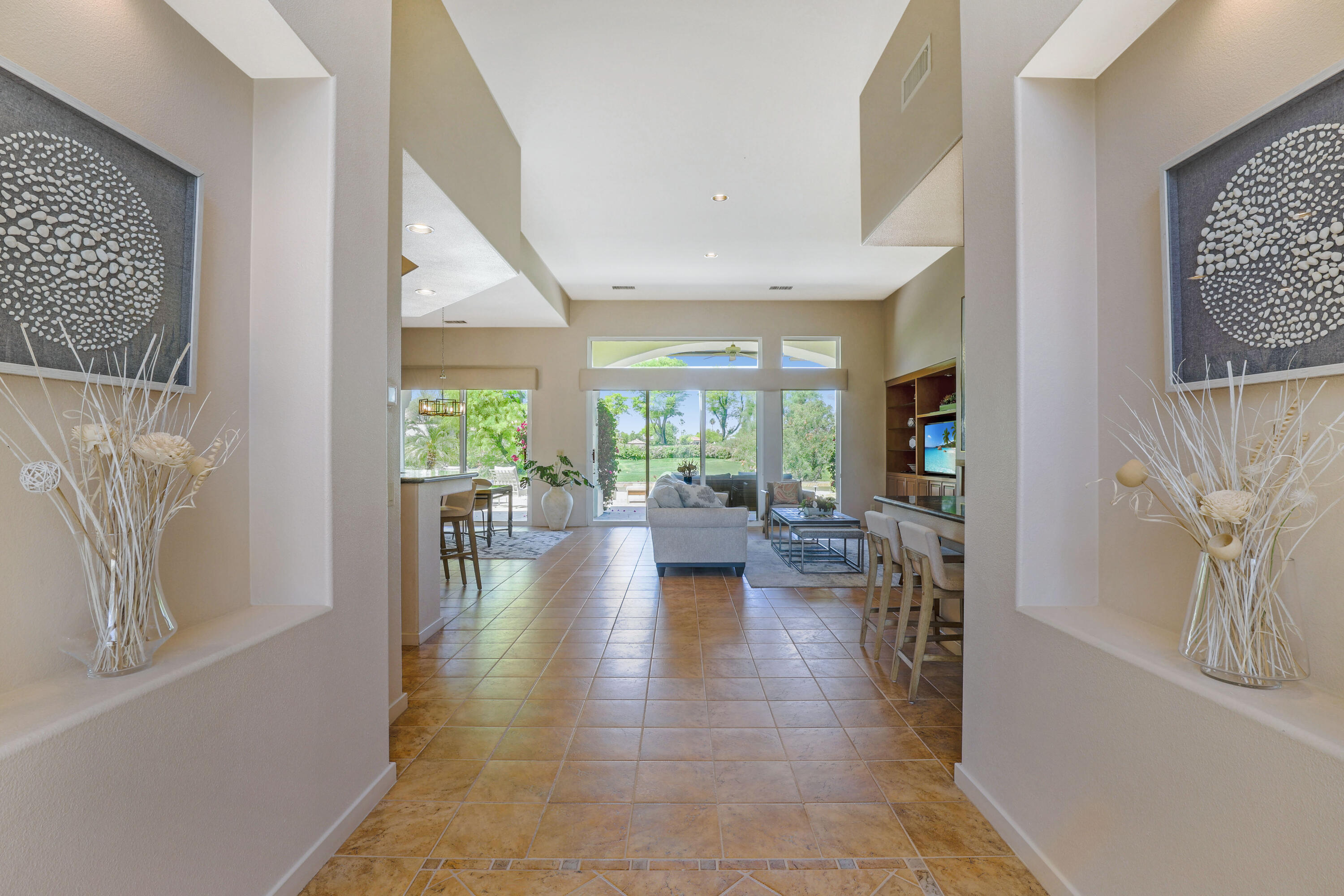 701 Indian Ridge Drive Palm Desert, CA 92211 - Photo 9 of 40 a lobby with furniture and floor to ceiling window
