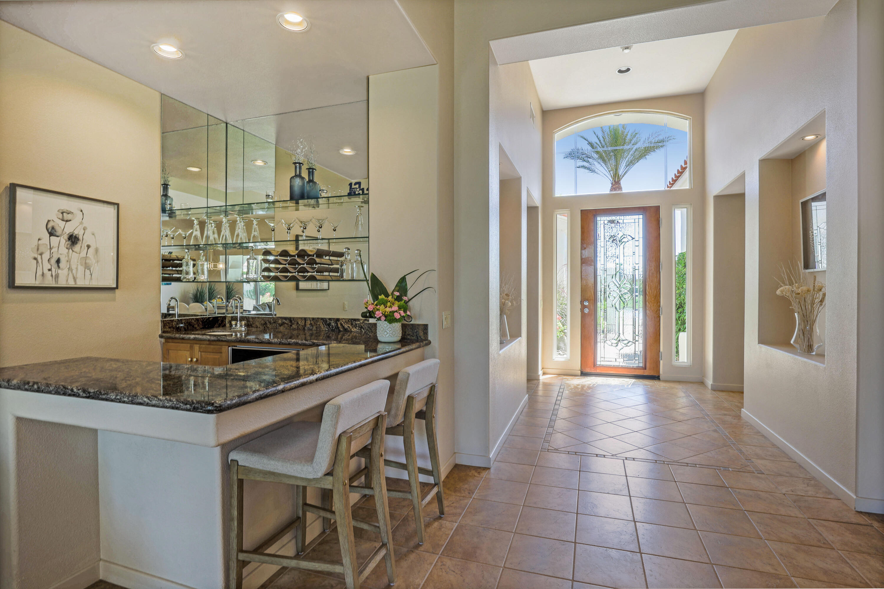 701 Indian Ridge Drive Palm Desert, CA 92211 - Photo 10 of 40 a kitchen with stainless steel appliances granite countertop a stove a sink and a refrigerator