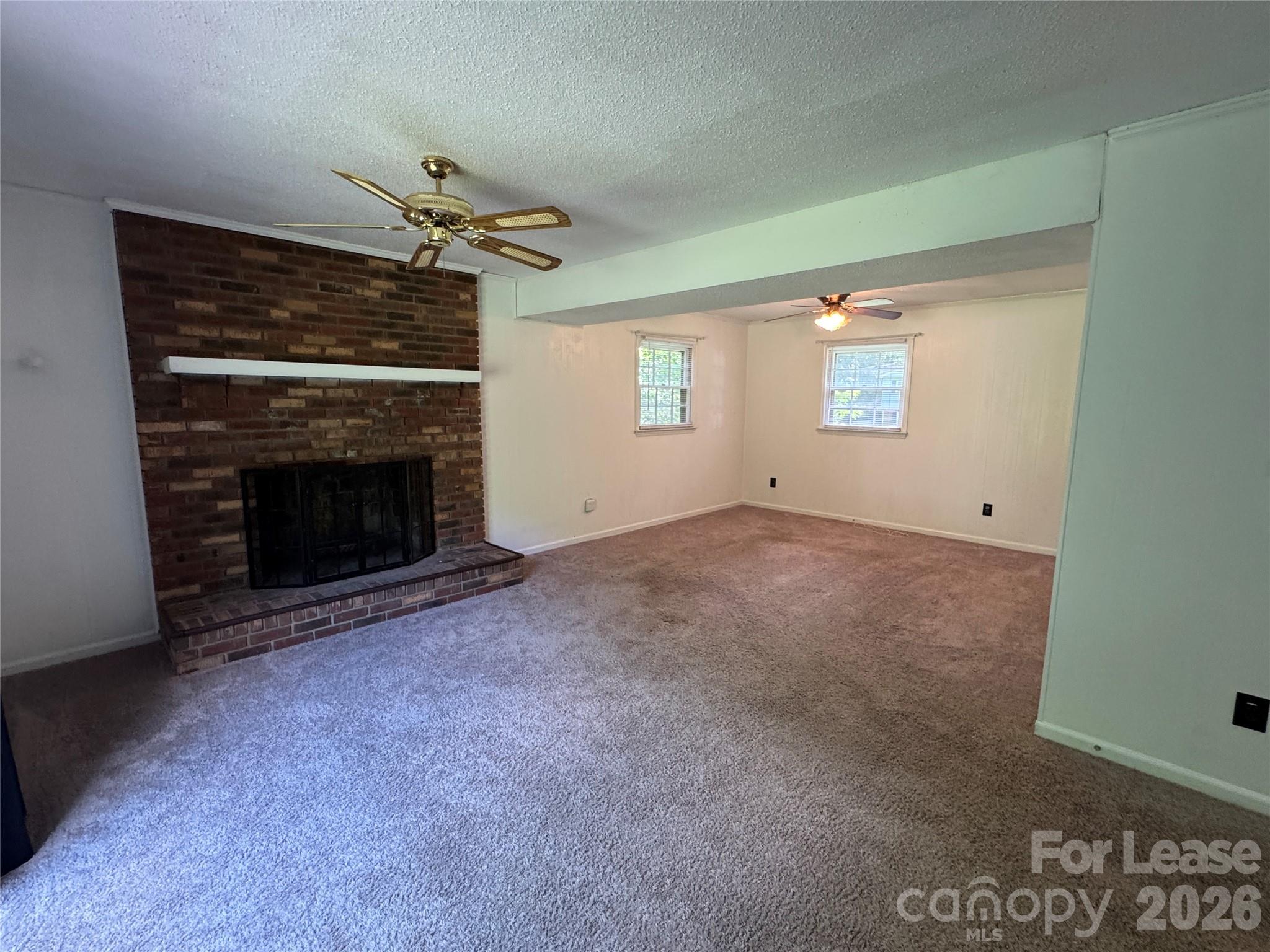 315 Pine Road Mount Holly, NC 28120 - Photo 18 of 21 a view of empty room with a fireplace