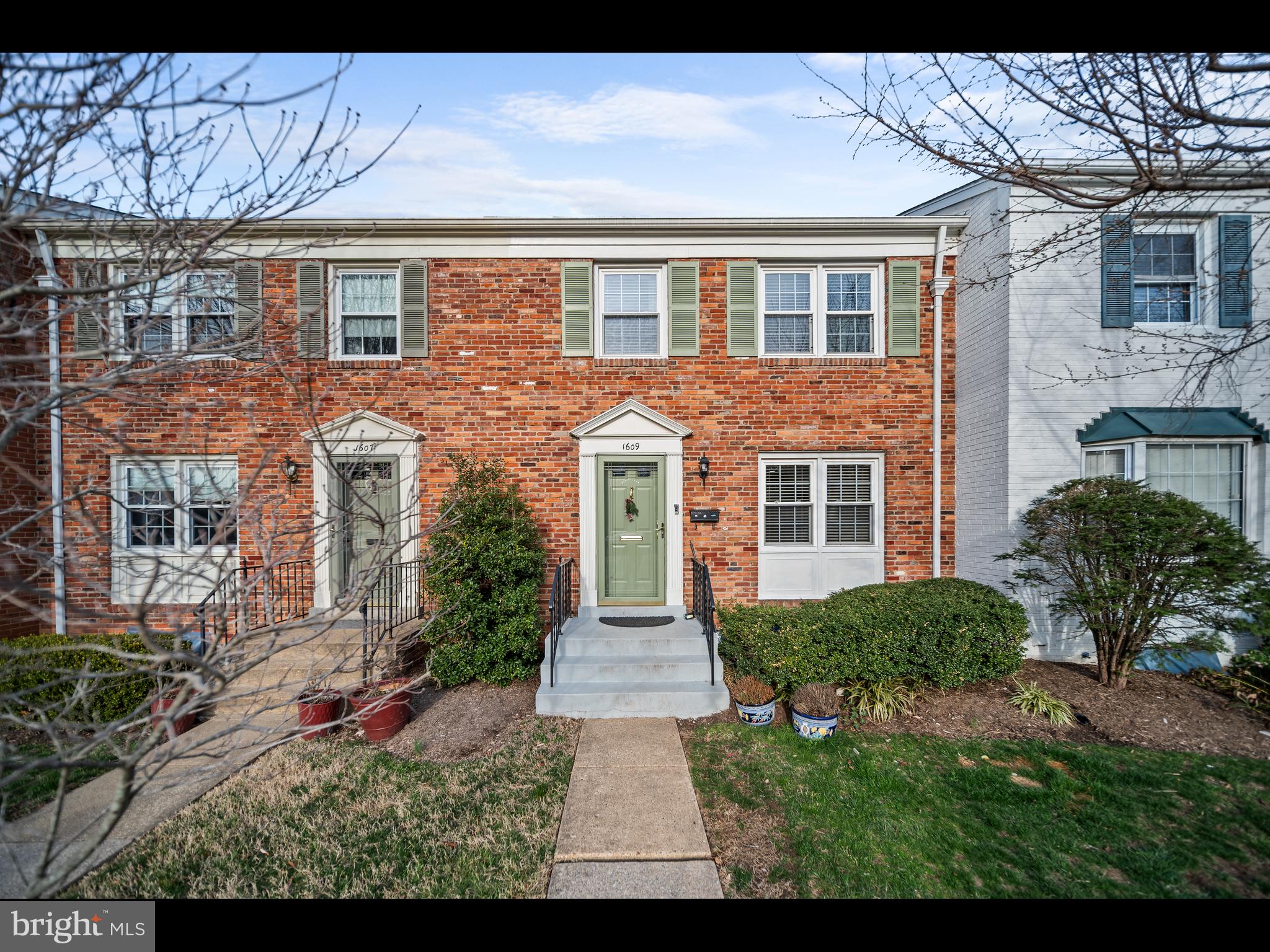 1609 Dunterry Place McLean, VA 22101 - Photo 1 of 36 a front view of a house with garden