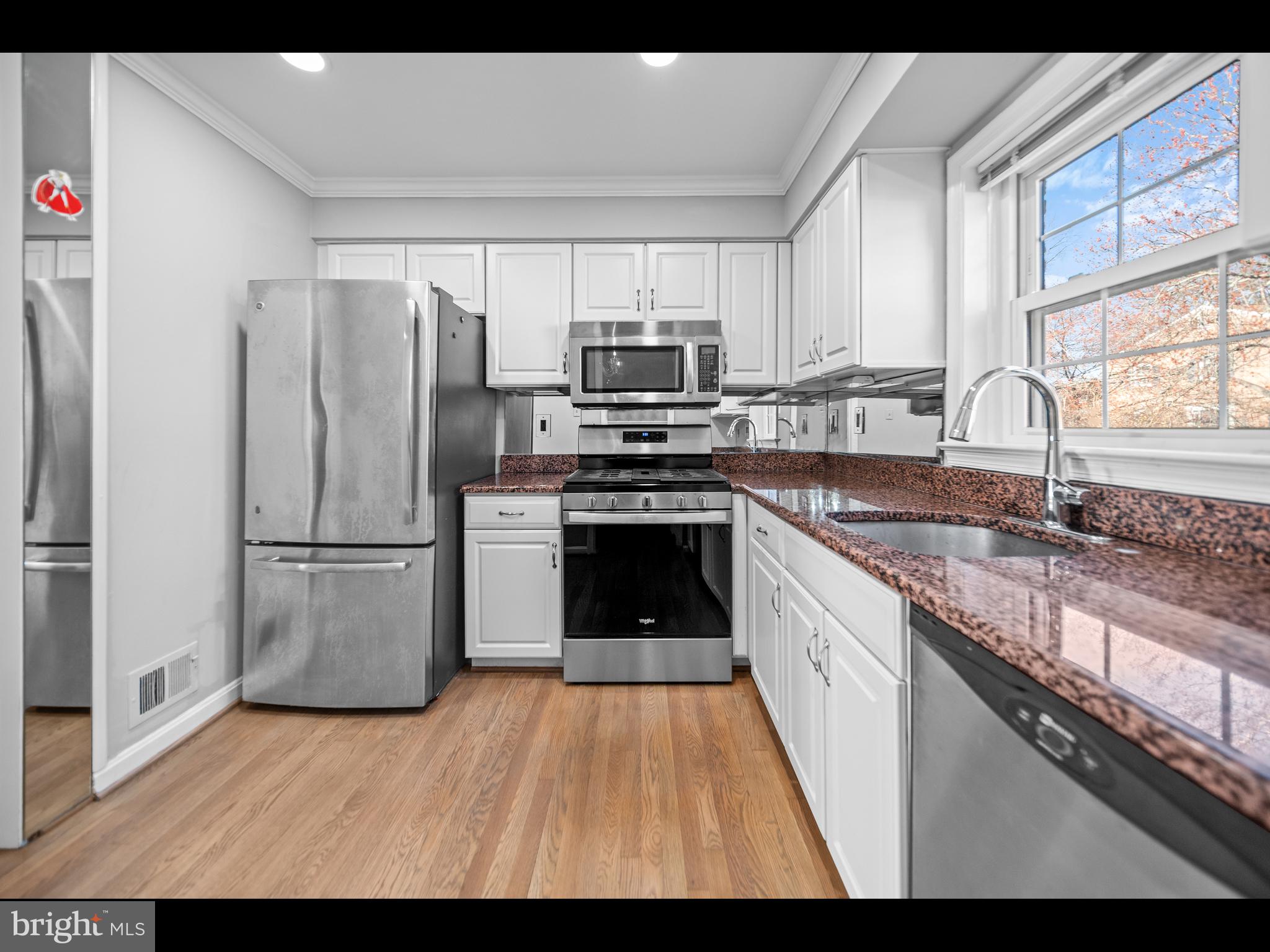 1609 Dunterry Place McLean, VA 22101 - Photo 11 of 36 a kitchen with a sink stove and refrigerator
