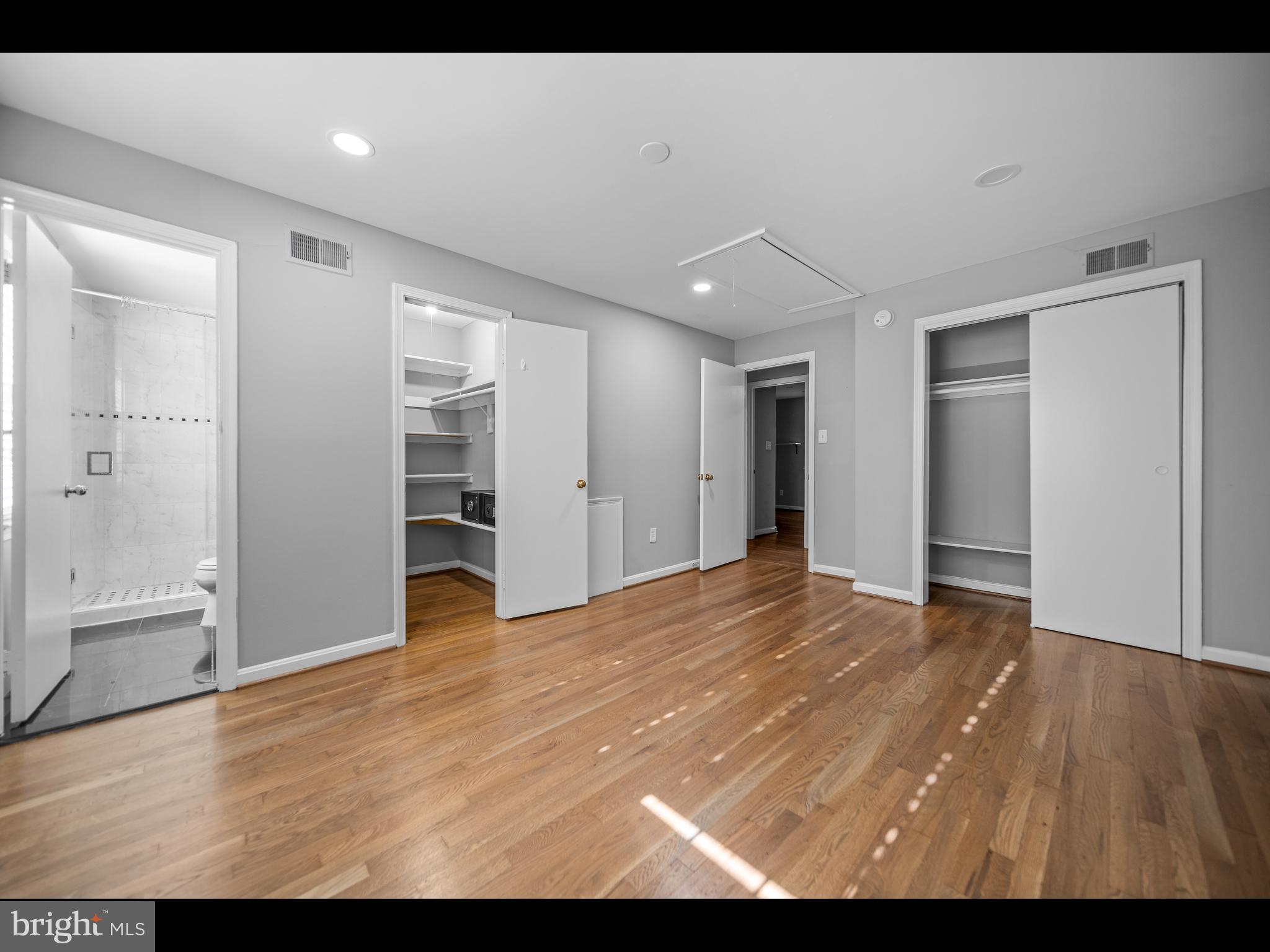 1609 Dunterry Place McLean, VA 22101 - Photo 21 of 36 a view of an empty room with wooden floor and closet