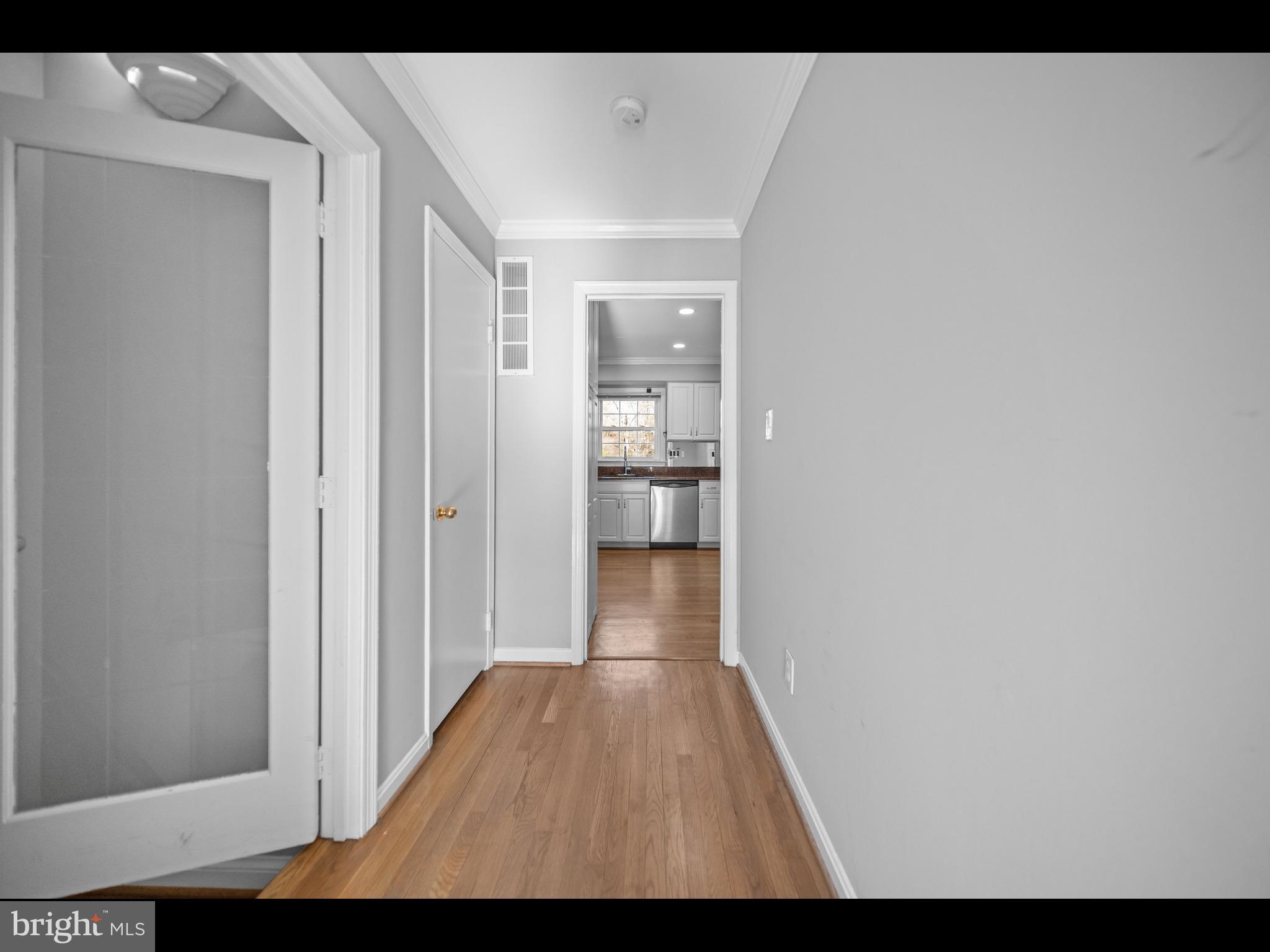 1609 Dunterry Place McLean, VA 22101 - Photo 4 of 36 a view of a hallway with wooden floor