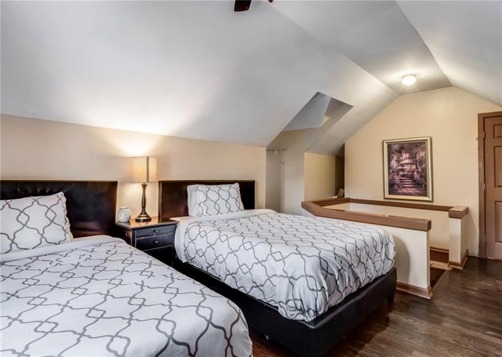 2846 Piedmont Road Northeast, Unit 1 Atlanta, GA 30305 - Photo 26 of 29 a bedroom with two beds and a night stand