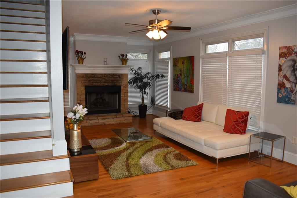2846 Piedmont Road Northeast, Unit 1 Atlanta, GA 30305 - Photo 8 of 29 a living room with furniture and a fireplace
