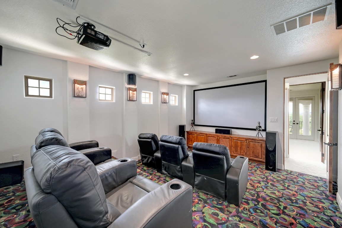 144 Serene Street Spring Branch, TX 78070 - Photo 19 of 37 a projector room with furniture