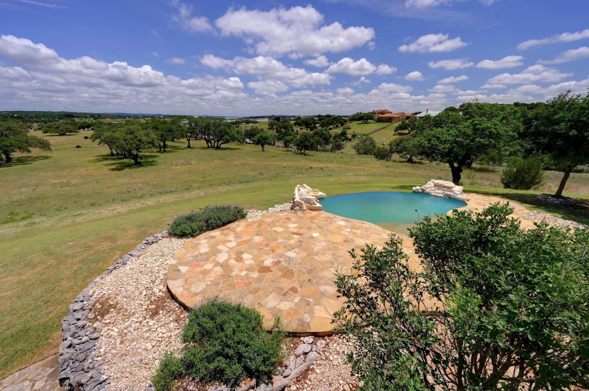 144 Serene Street Spring Branch, TX 78070 - Photo 21 of 37 a view of a lake with a building in the background