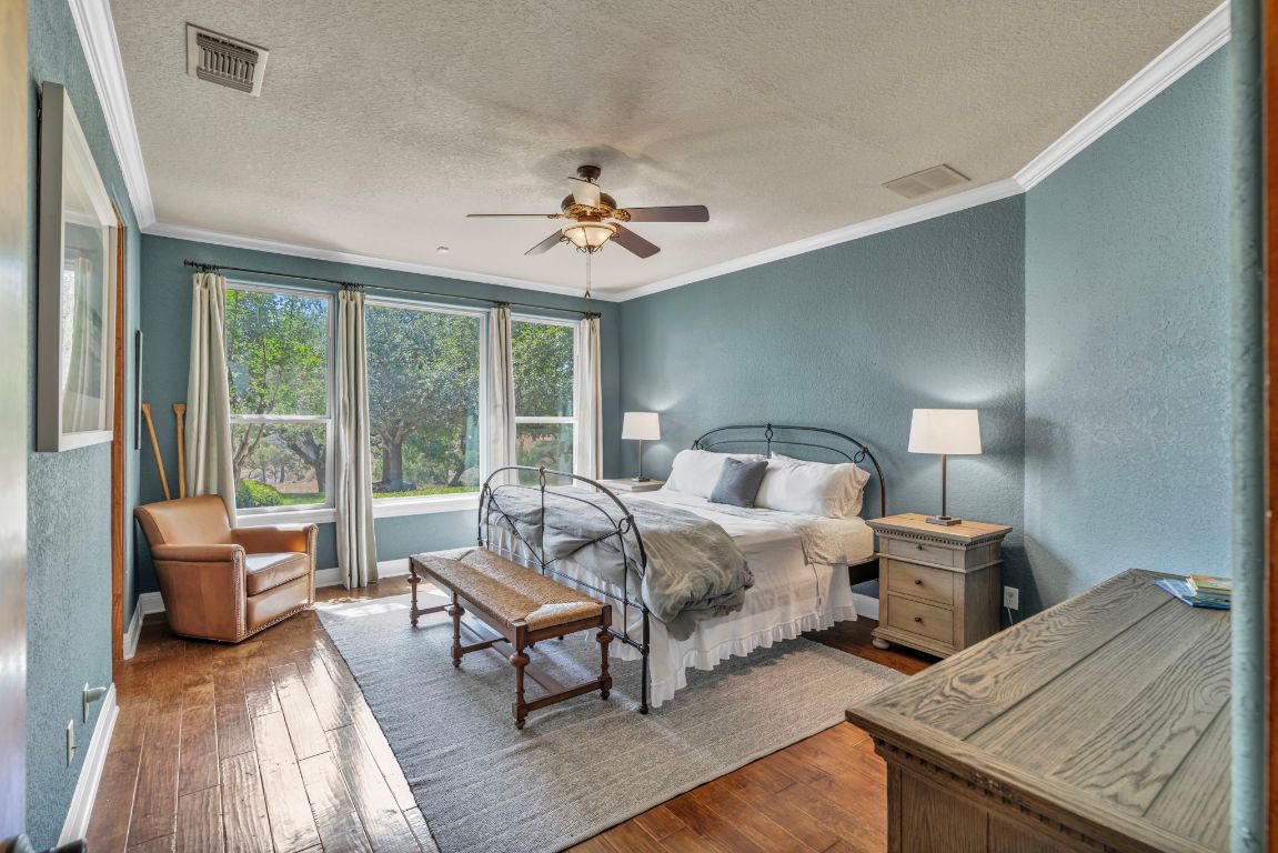 144 Serene Street Spring Branch, TX 78070 - Photo 27 of 37 a spacious bedroom with a bed and a couch