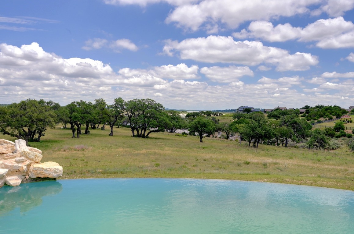 144 Serene Street Spring Branch, TX 78070 - Photo 30 of 37 a view of a swimming pool and lounge chairs