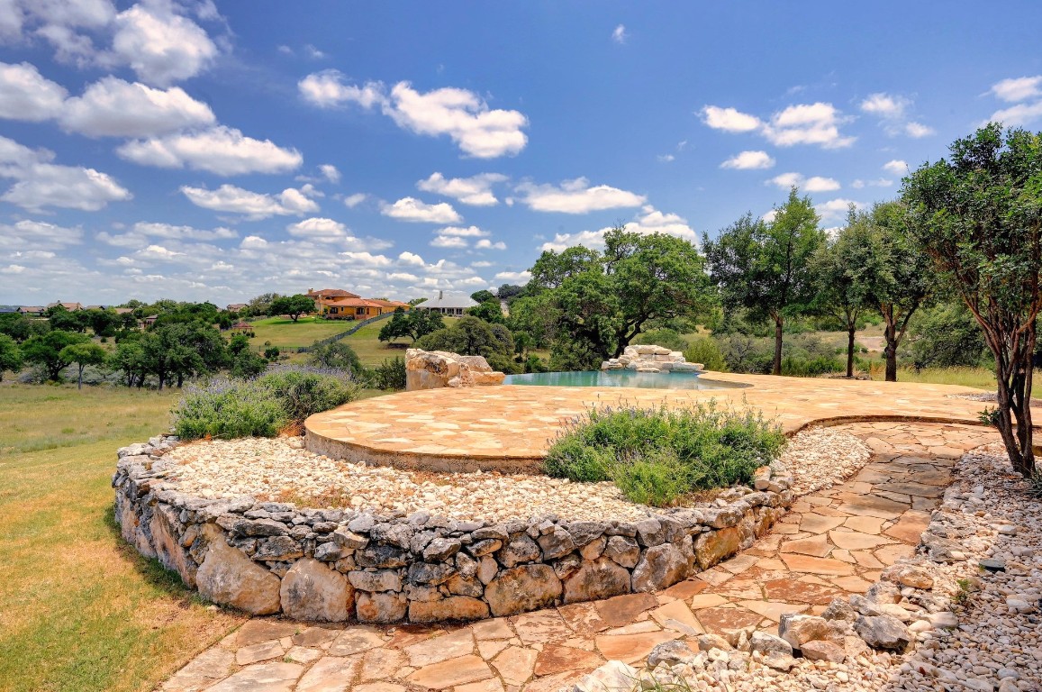144 Serene Street Spring Branch, TX 78070 - Photo 31 of 37 a outdoor view with swimming pool and green space