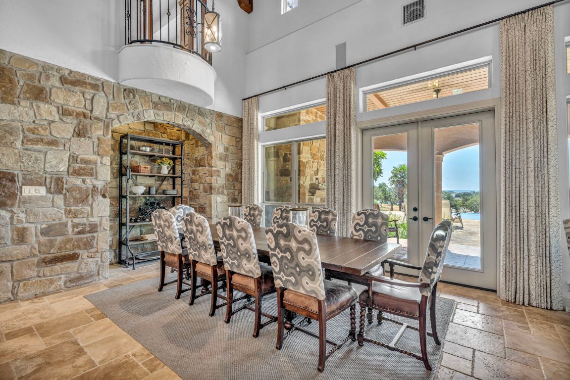 144 Serene Street Spring Branch, TX 78070 - Photo 10 of 37 a view of a dining room with furniture and chandelier