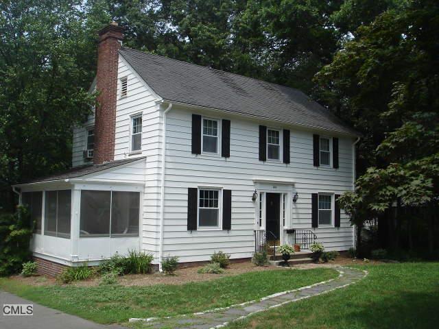 144 Long Hill Road Wallingford, CT 06492 - Photo 1 of 1 a backyard of a house with potted plants and large tree
