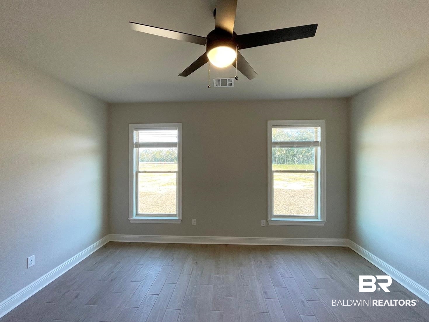 1392 Fenton Circle Foley, AL 36535 - Photo 6 of 17 Unfurnished room featuring ceiling fan and light hardwood / wood-style flooring