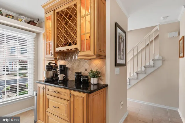 a kitchen with stainless steel appliances granite countertop a stove and a refrigerator