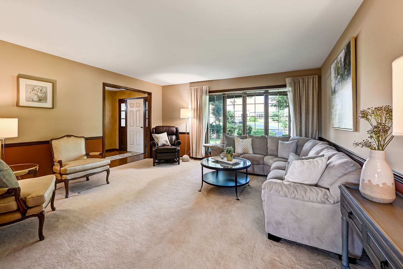 8141 Ridgepoint Drive Burr Ridge, IL 60527 - Photo 5 of 46 a living room with furniture and a fireplace