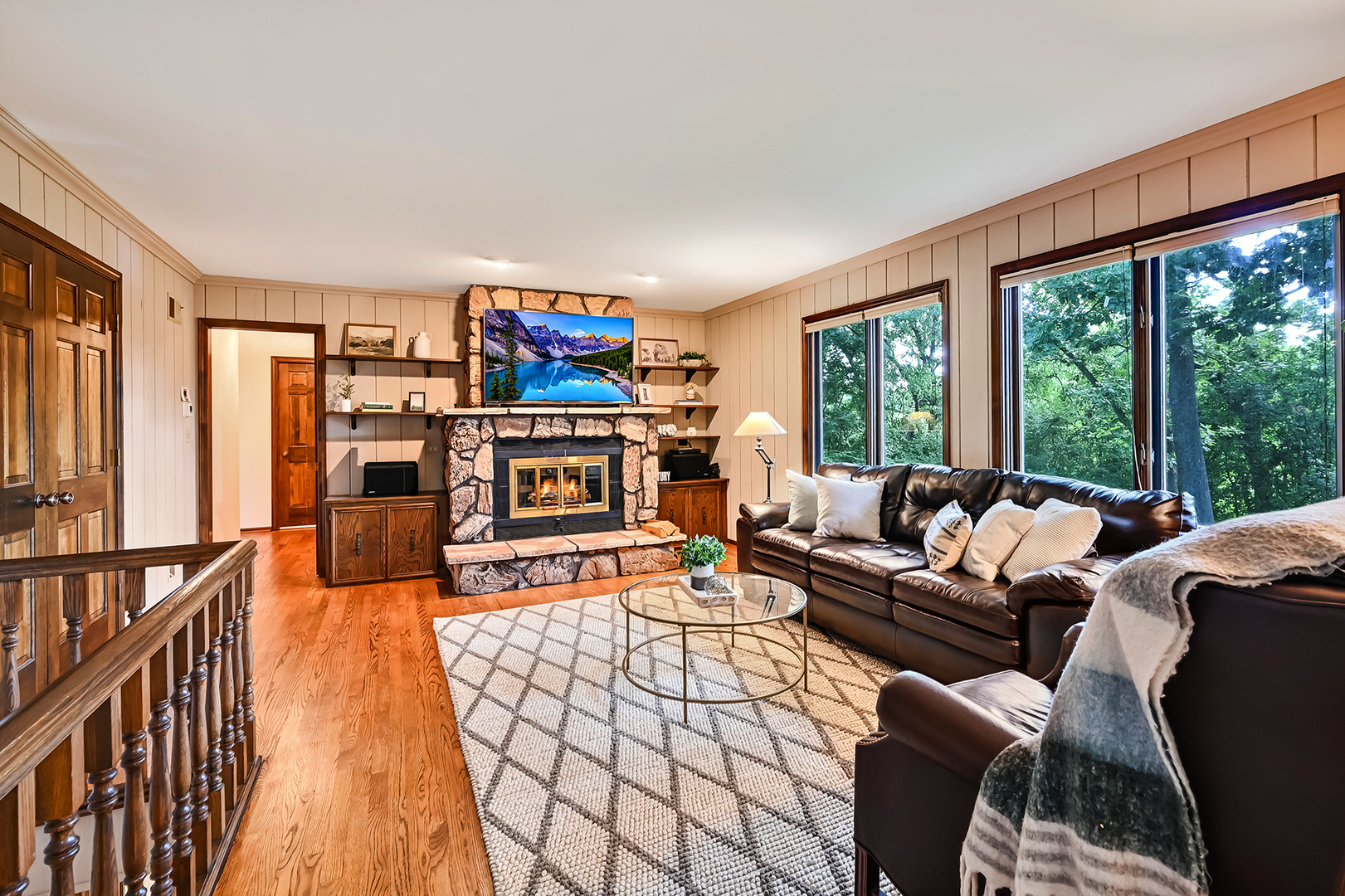 8141 Ridgepoint Drive Burr Ridge, IL 60527 - Photo 6 of 46 a living room with furniture a fireplace and large windows