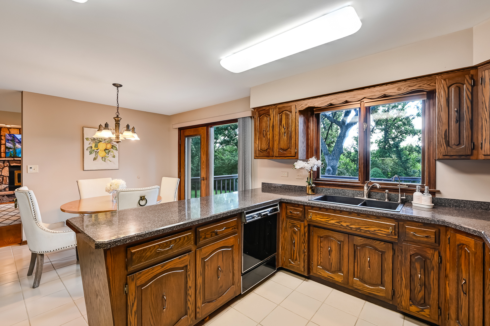 8141 Ridgepoint Drive Burr Ridge, IL 60527 - Photo 10 of 46 a kitchen with a sink stove and microwave
