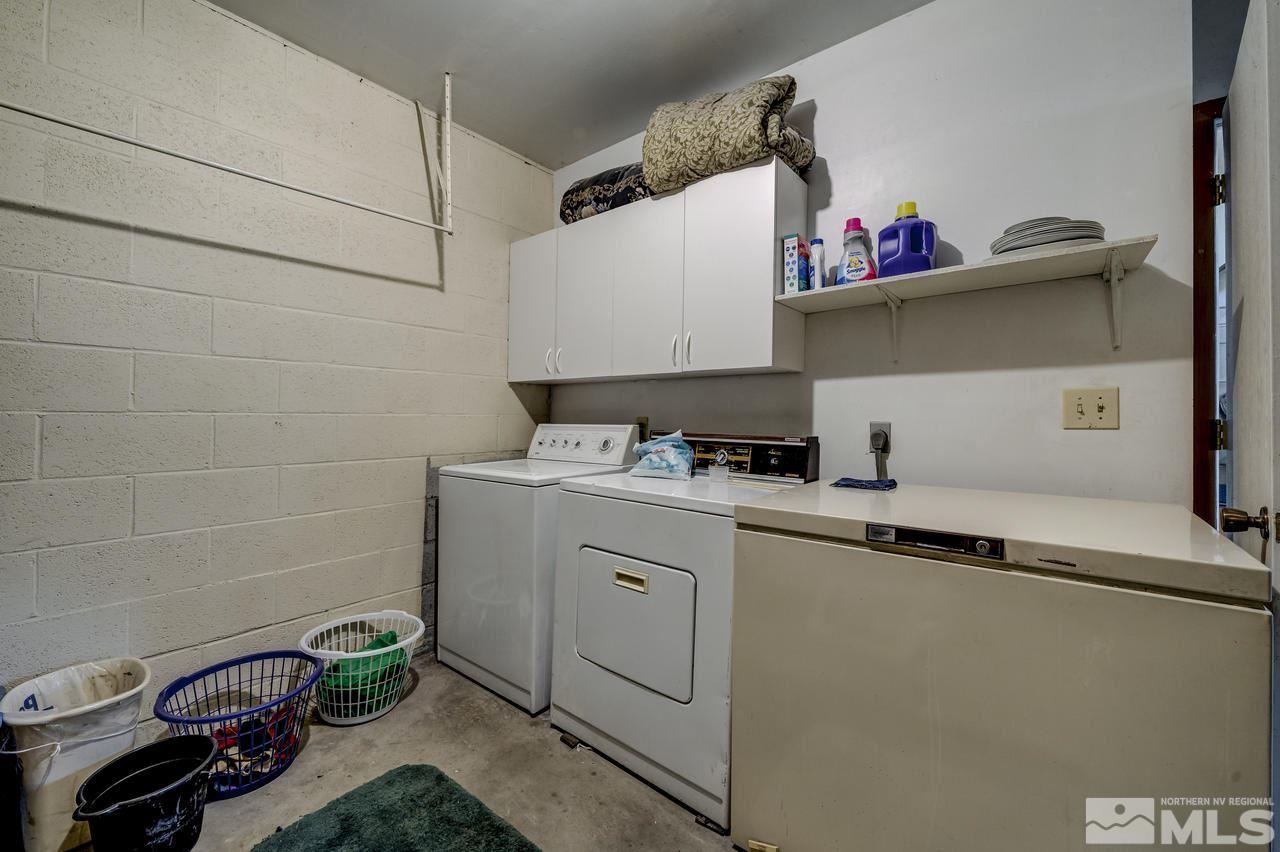 16500 Toll Road Reno, NV 89521 - Photo 16 of 25 a kitchen with a sink a stove and cabinets