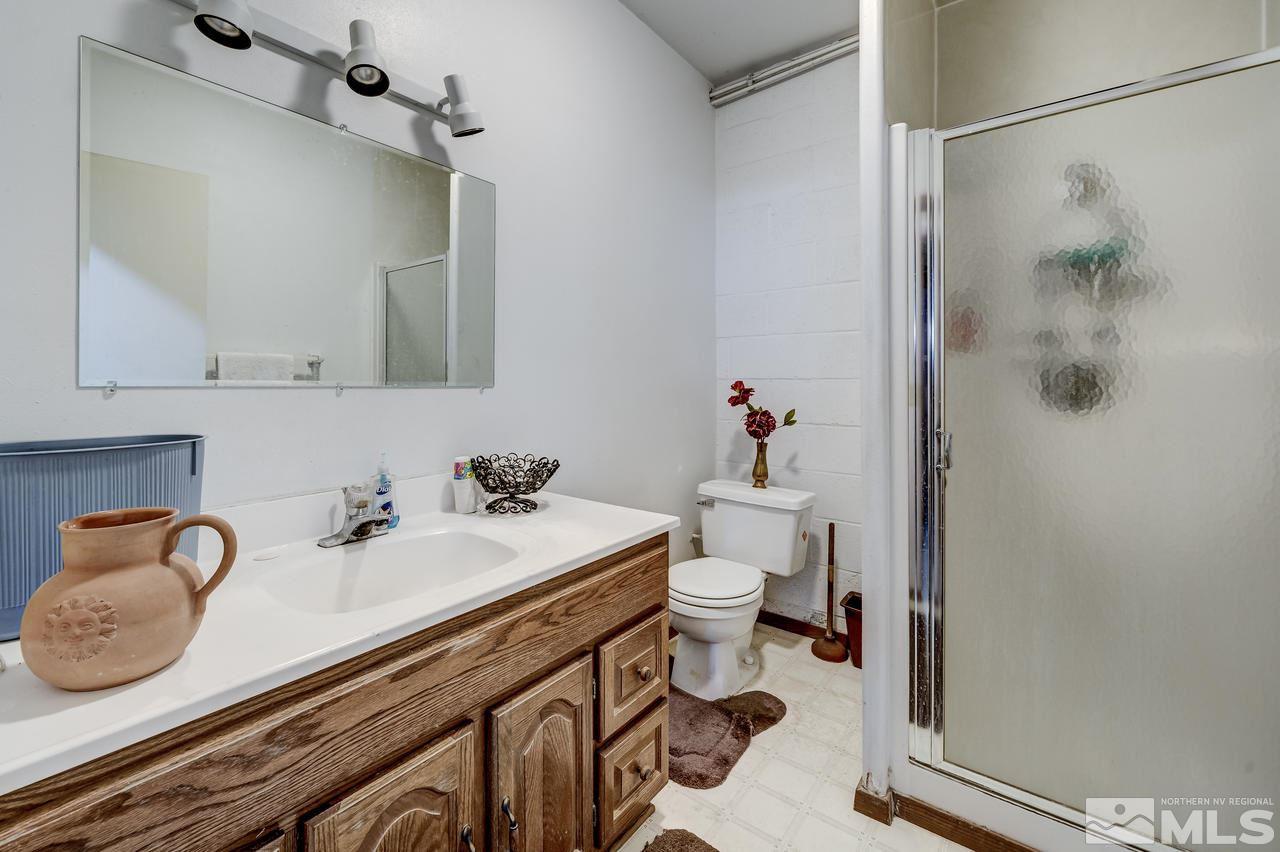 16500 Toll Road Reno, NV 89521 - Photo 17 of 25 a bathroom with a sink and a mirror
