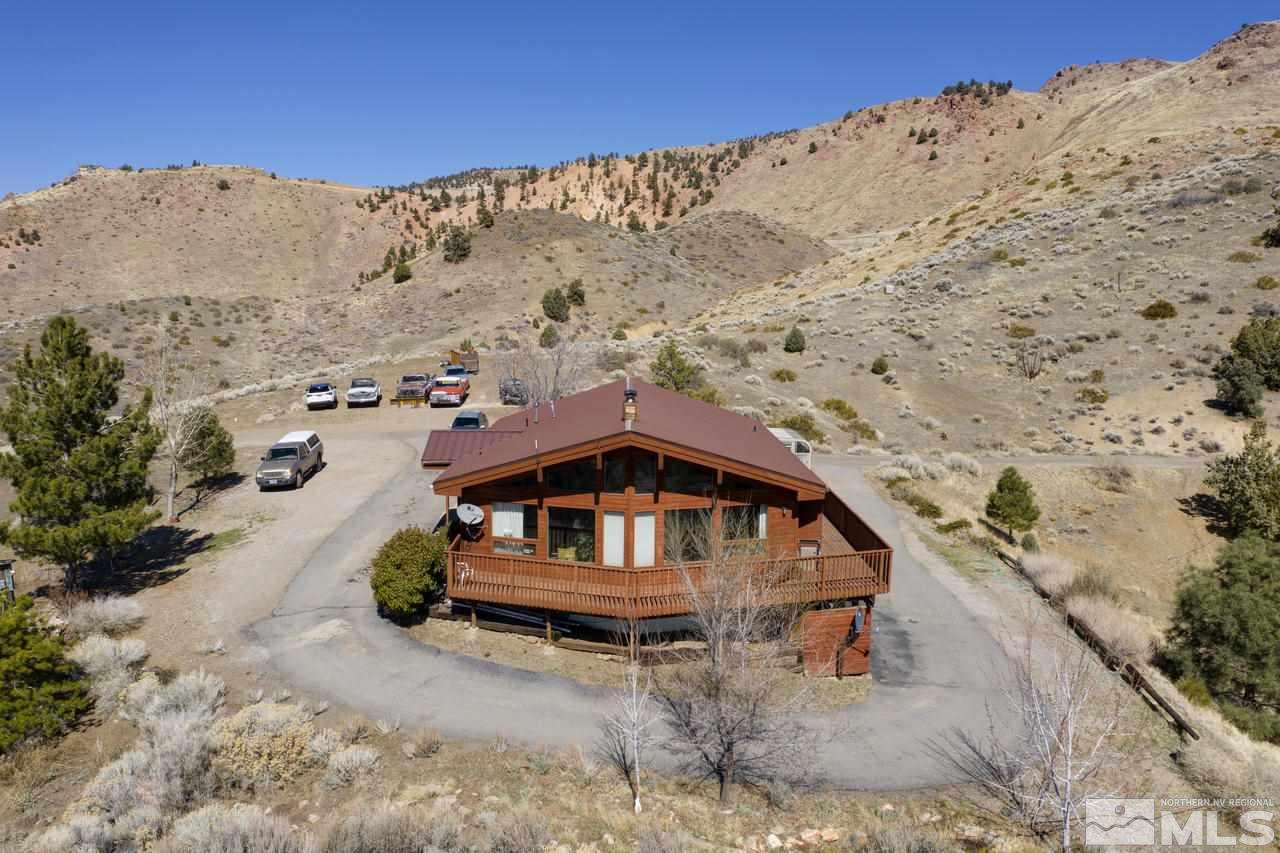 16500 Toll Road Reno, NV 89521 - Photo 2 of 25 a house with a mountain in the background